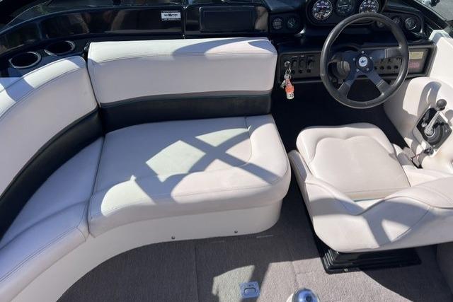1996 MasterCraft ProStar 190 interior with white seating and steering wheel.