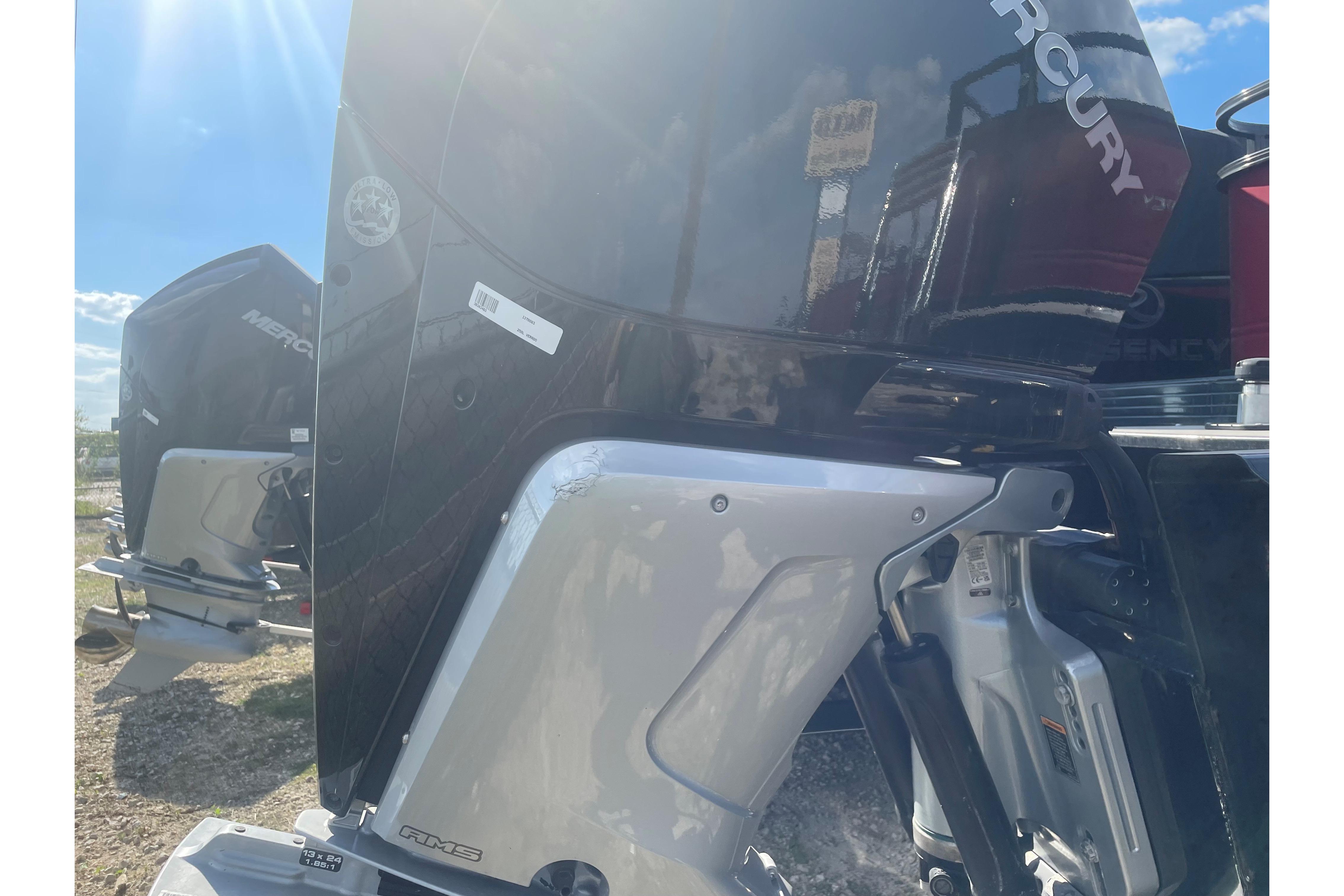 2023 Regency 250DL3 boat with Mercury outboard motor in sunlight.