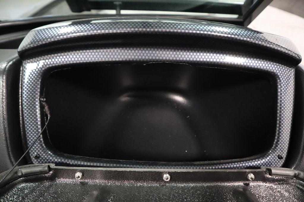 Open storage compartment in 2026 Lowe Fishing Machine 175 boat.