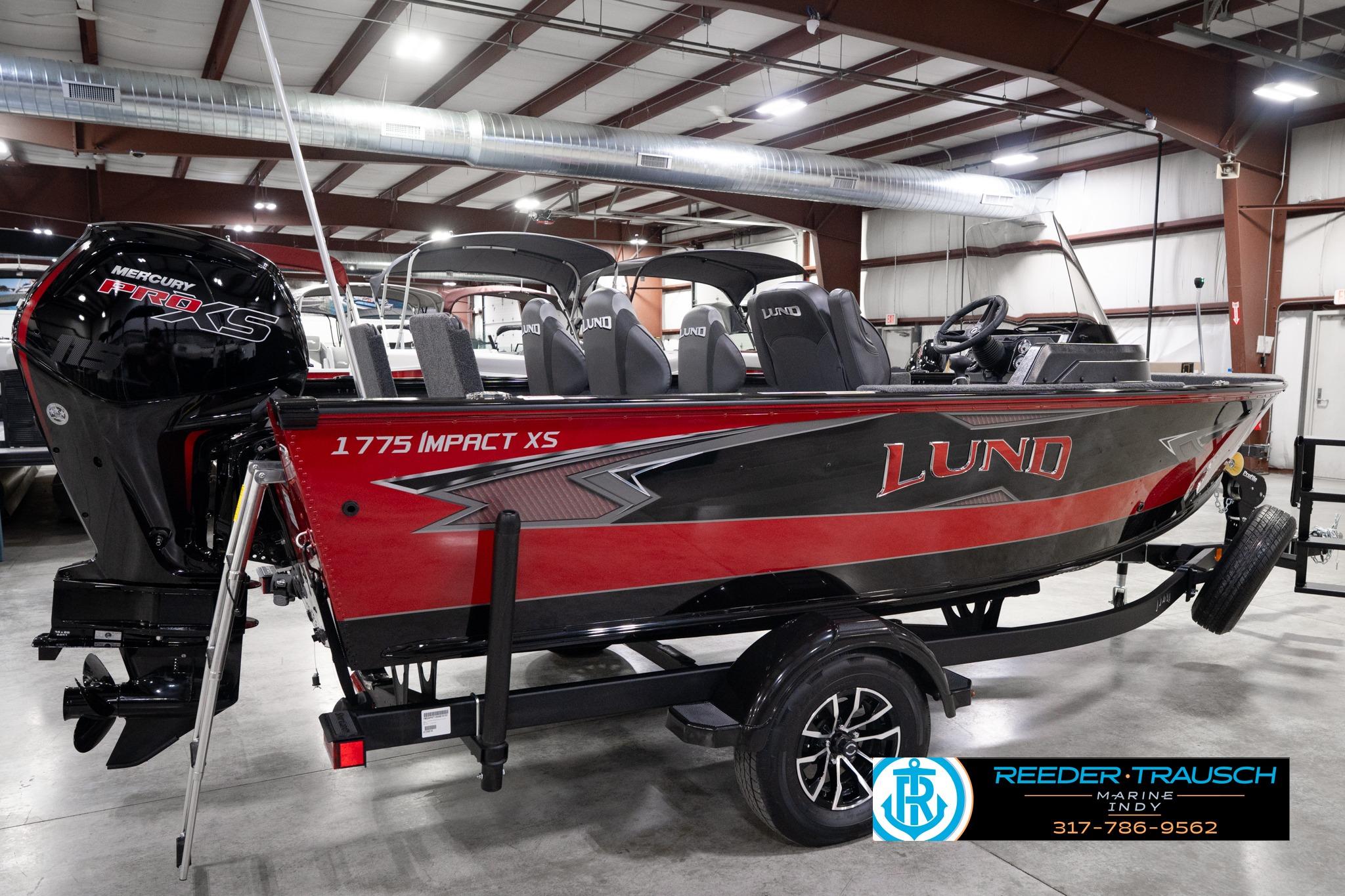 2026 Lund 1775 Impact XS SS boat in showroom, featuring Mercury Pro XS engine.