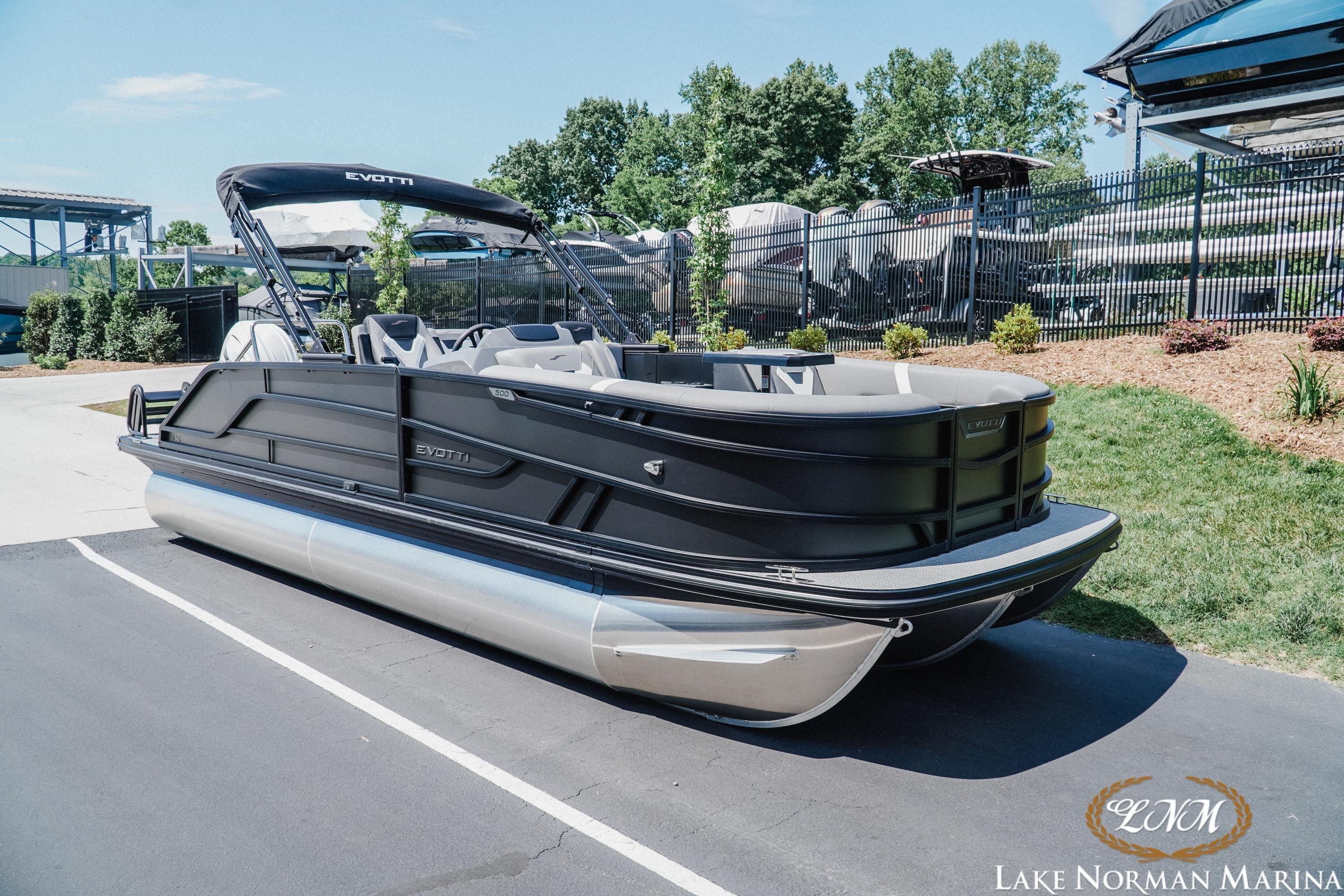 2026 Evotti 521CS pontoon boat at Lake Norman Marina, featuring sleek black design.