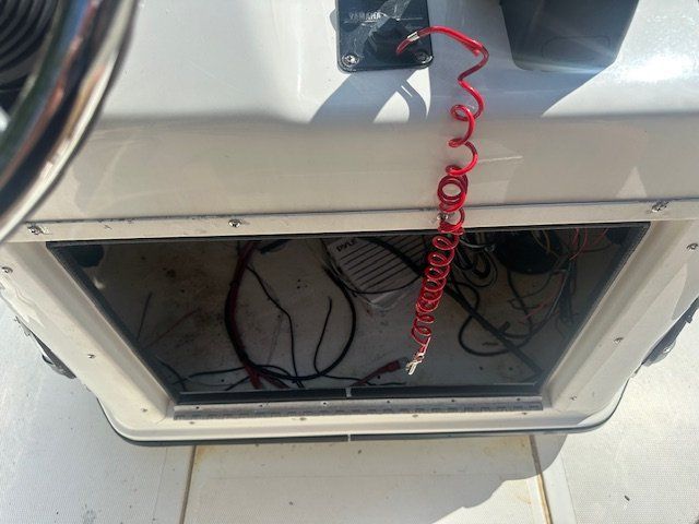 Interior view of a 2003 Skeeter ZX2200 boat with red safety cord.