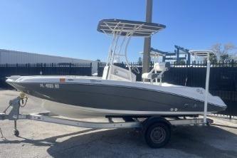 2016 Yamaha Boats 190 FSH Sport on trailer, parked outdoors under clear blue sky.