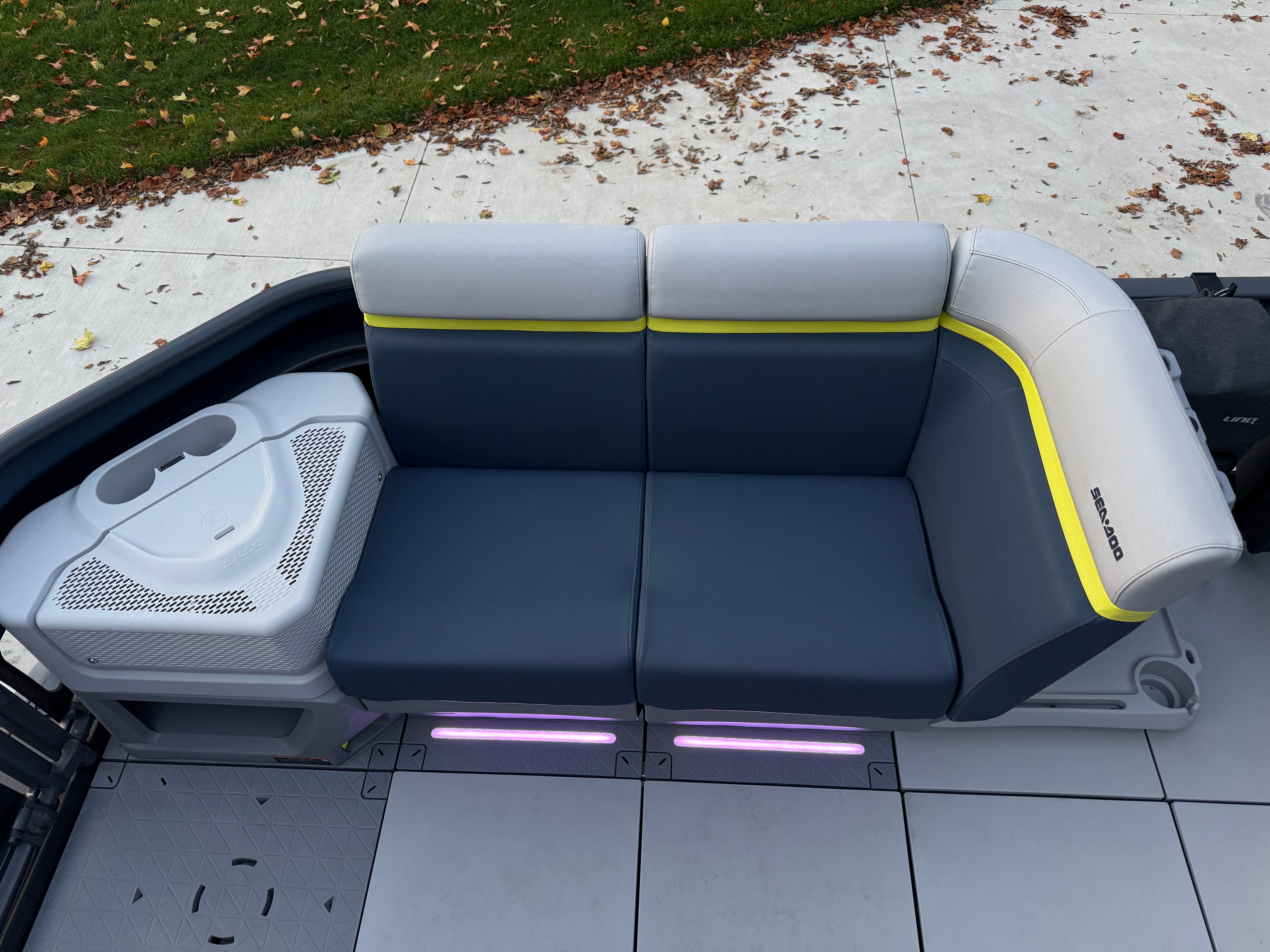The image shows a modern boat seat with blue and gray upholstery.