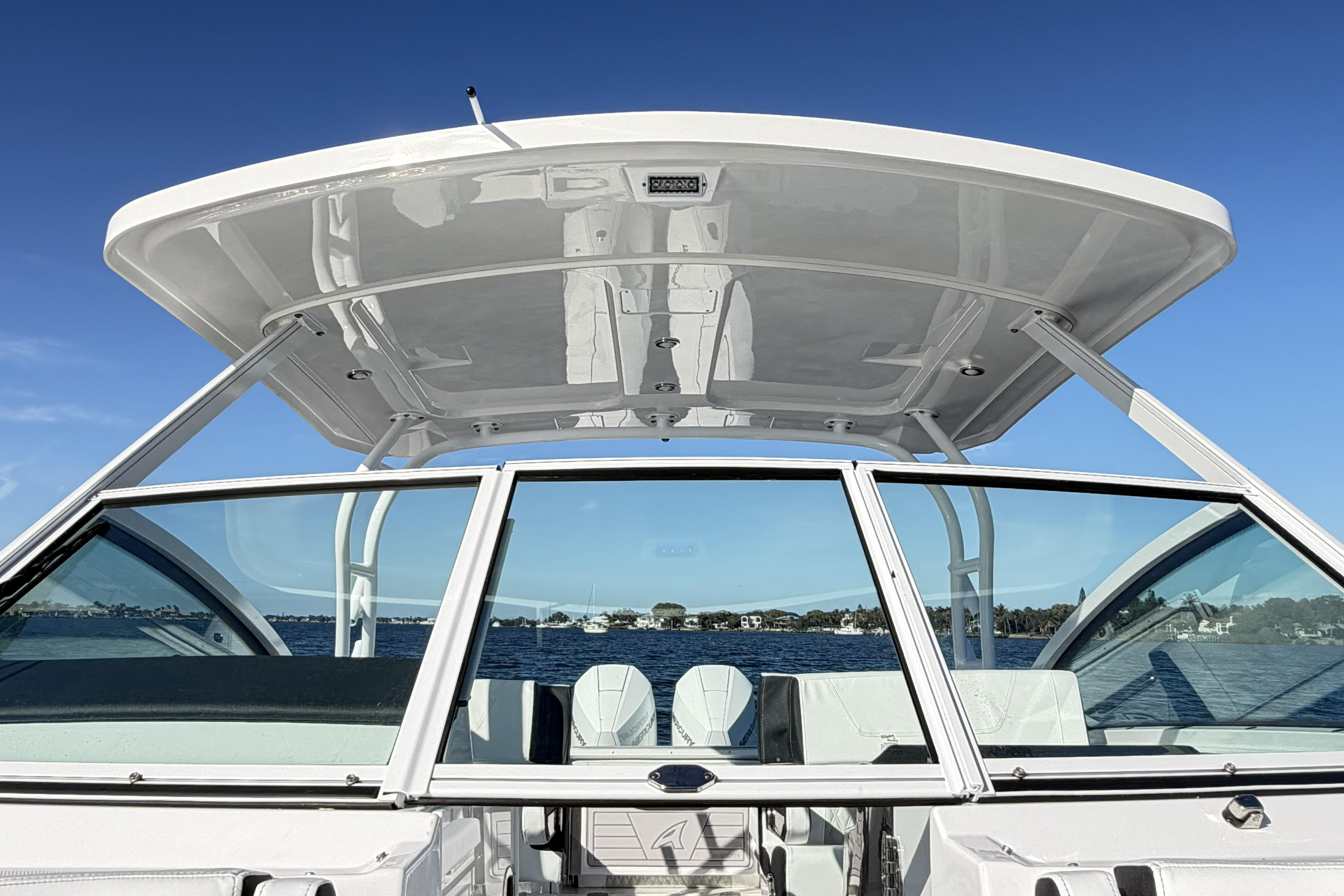 2025 Blackfin 272 DC boat on water, showcasing sleek design and spacious cockpit.