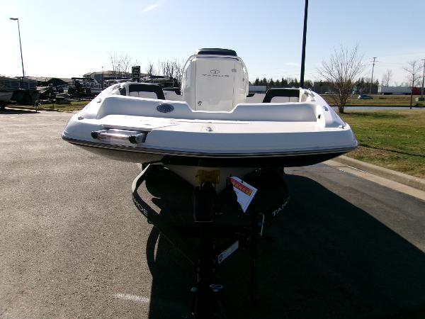 2024 Tahoe 2150 CC boat on trailer, parked outdoors in a sunny setting.