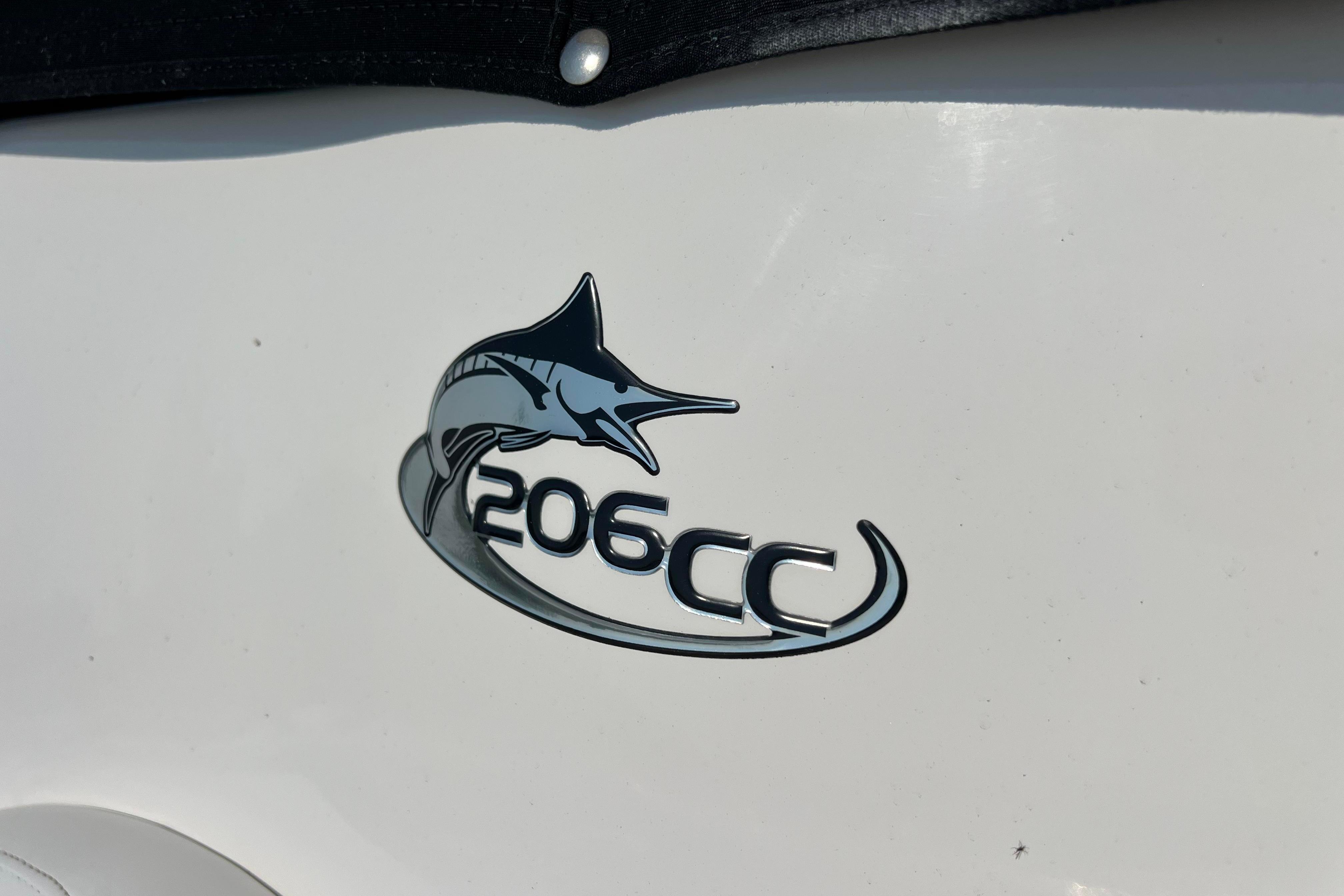Emblem of 2012 Sea Fox 206 Center Console boat featuring a marlin design.
