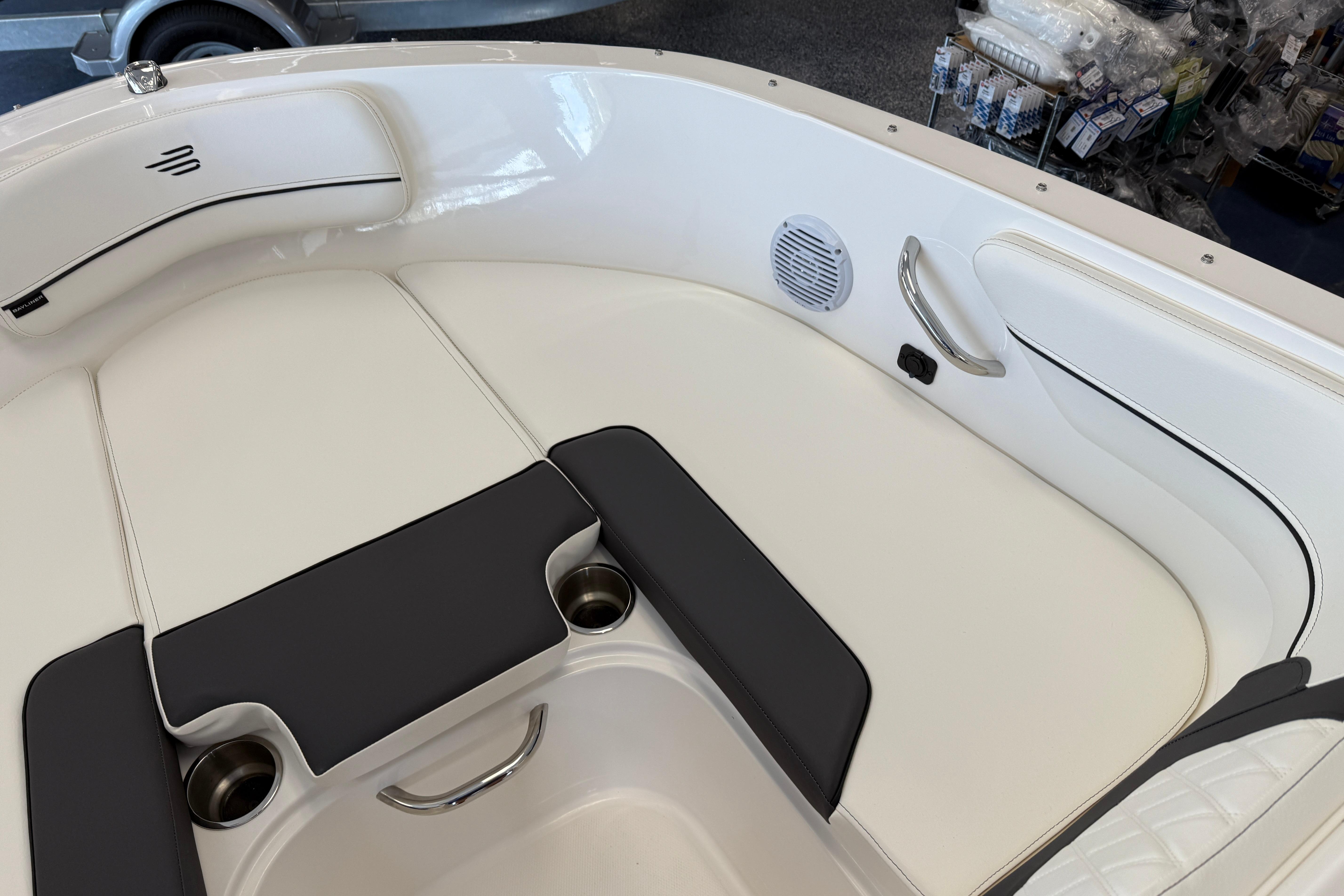 2025 Bayliner VR4 Bowrider OB interior with white seating and cup holders.