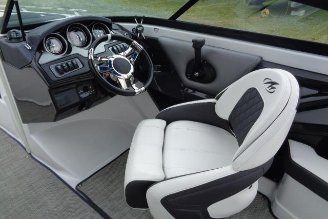 2019 Monterey 218SS Super Sport boat interior with steering wheel and captain's chair.