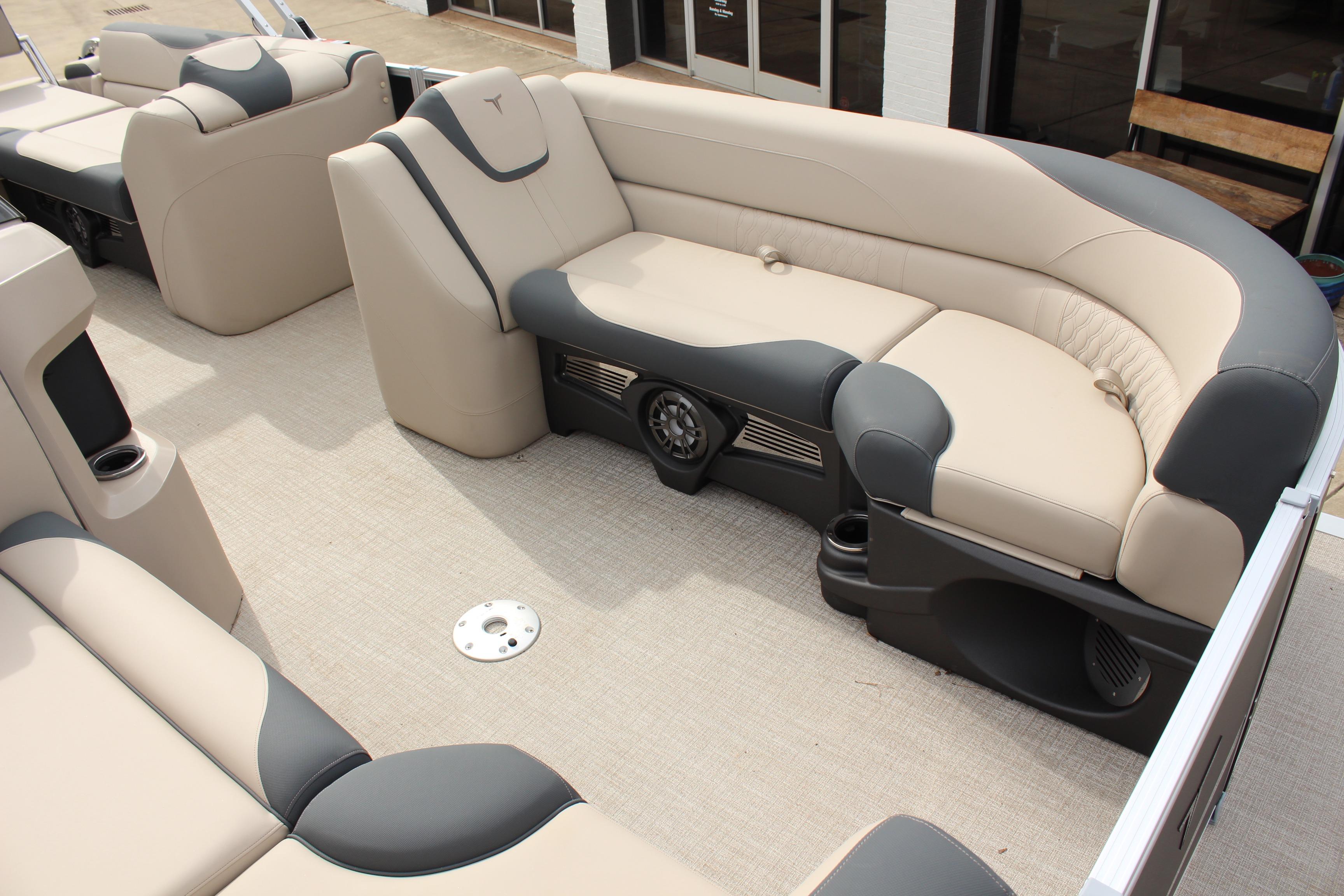 2026 Tahoe Pontoon LTZ interior with beige and gray seating, showcasing luxury and comfort.
