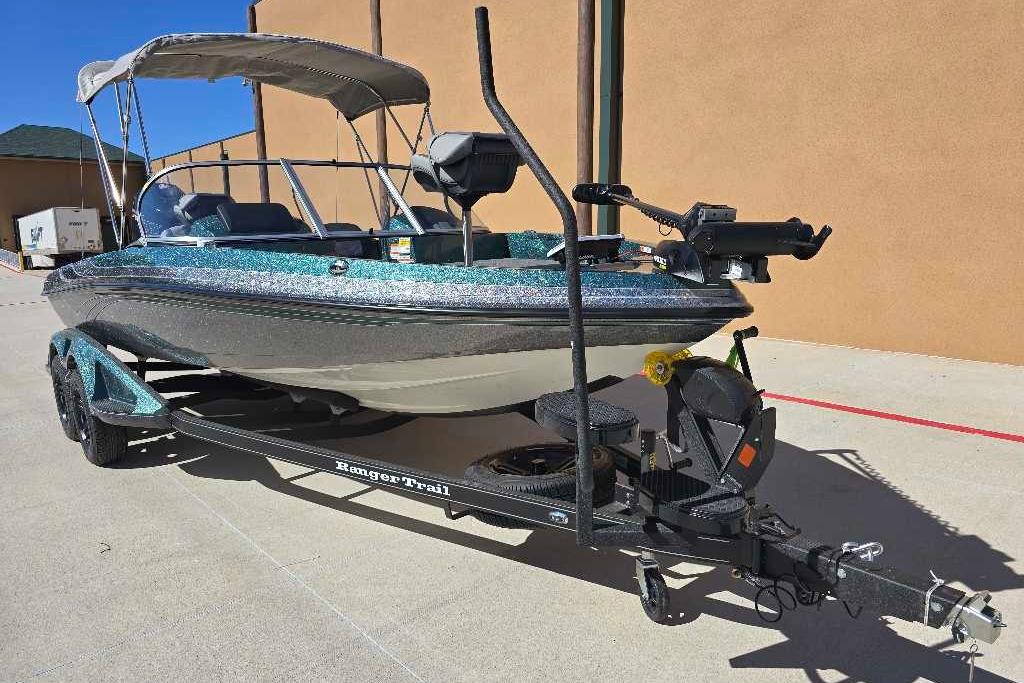 2026 Ranger 212LS boat on trailer, parked outdoors, featuring a sleek design and canopy.