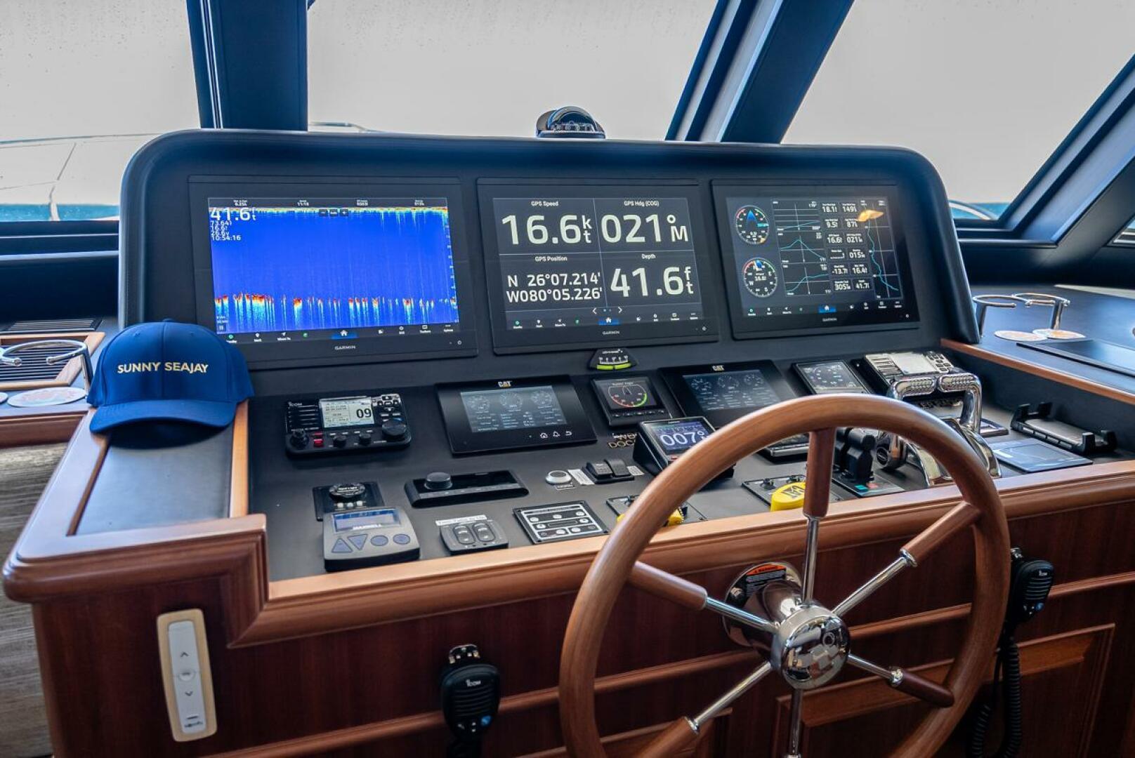 2022 Hampton 658l Endurance yacht helm with advanced navigation displays and controls.