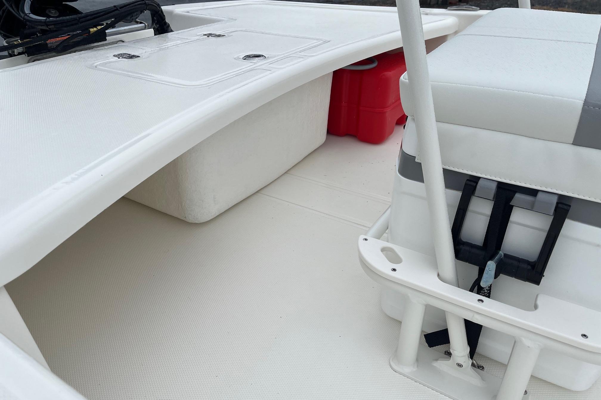 2026 Mako Pro Skiff 17 CC interior with seating and storage compartments.