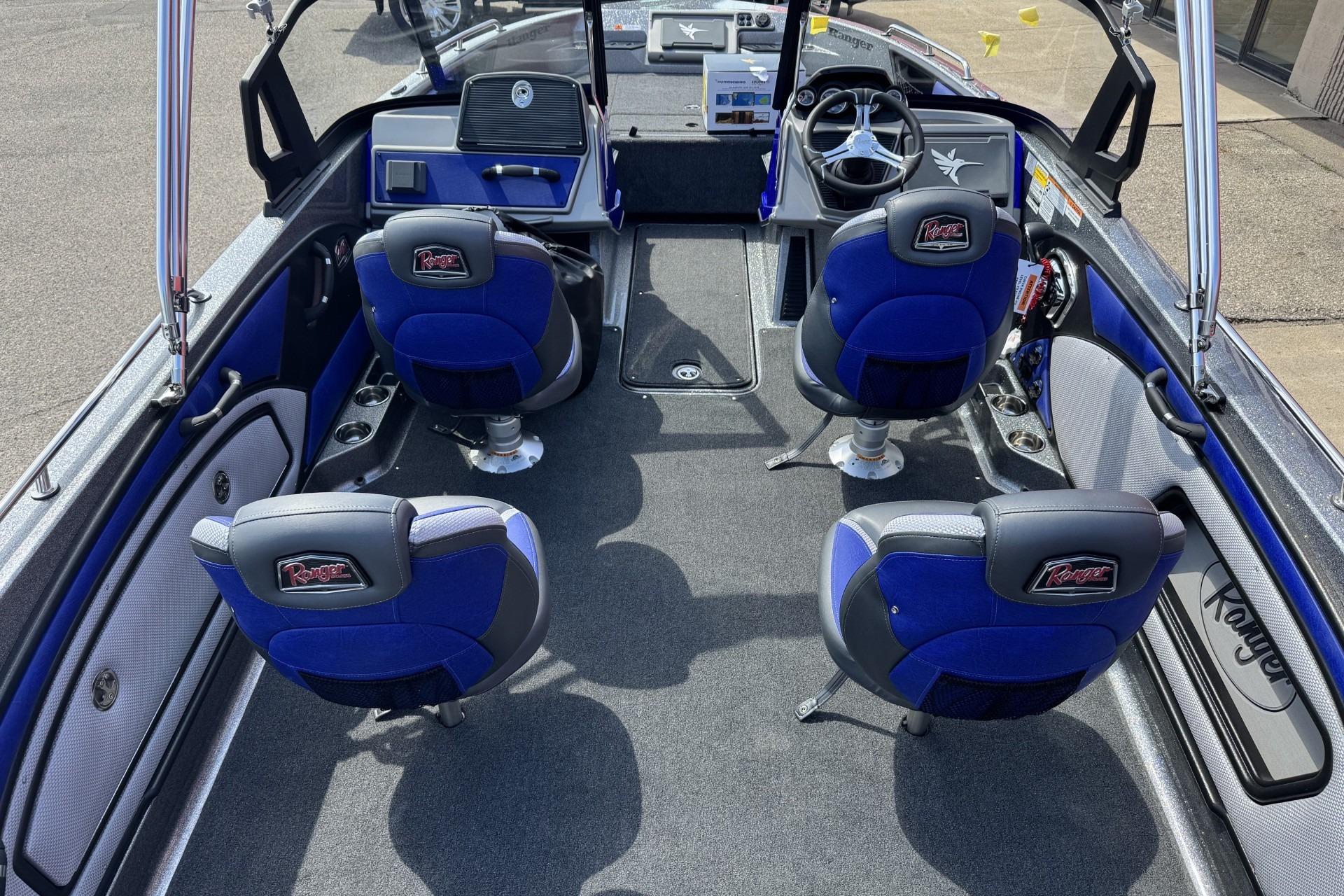 Interior of 2026 Ranger 2050MS boat with blue seating and modern dashboard.