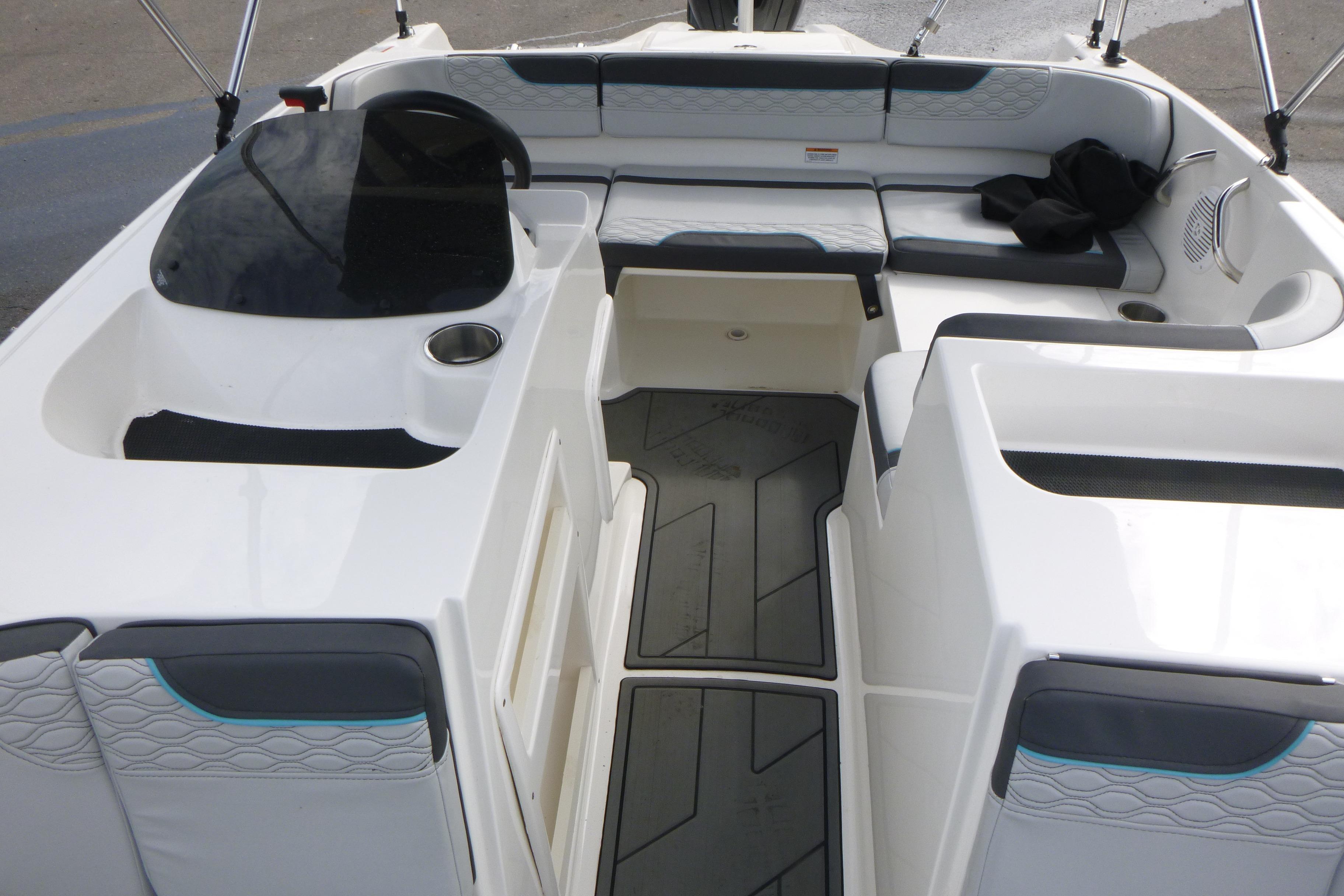 2022 Bayliner Element M17 boat interior with seating and helm, featuring modern design and comfort.