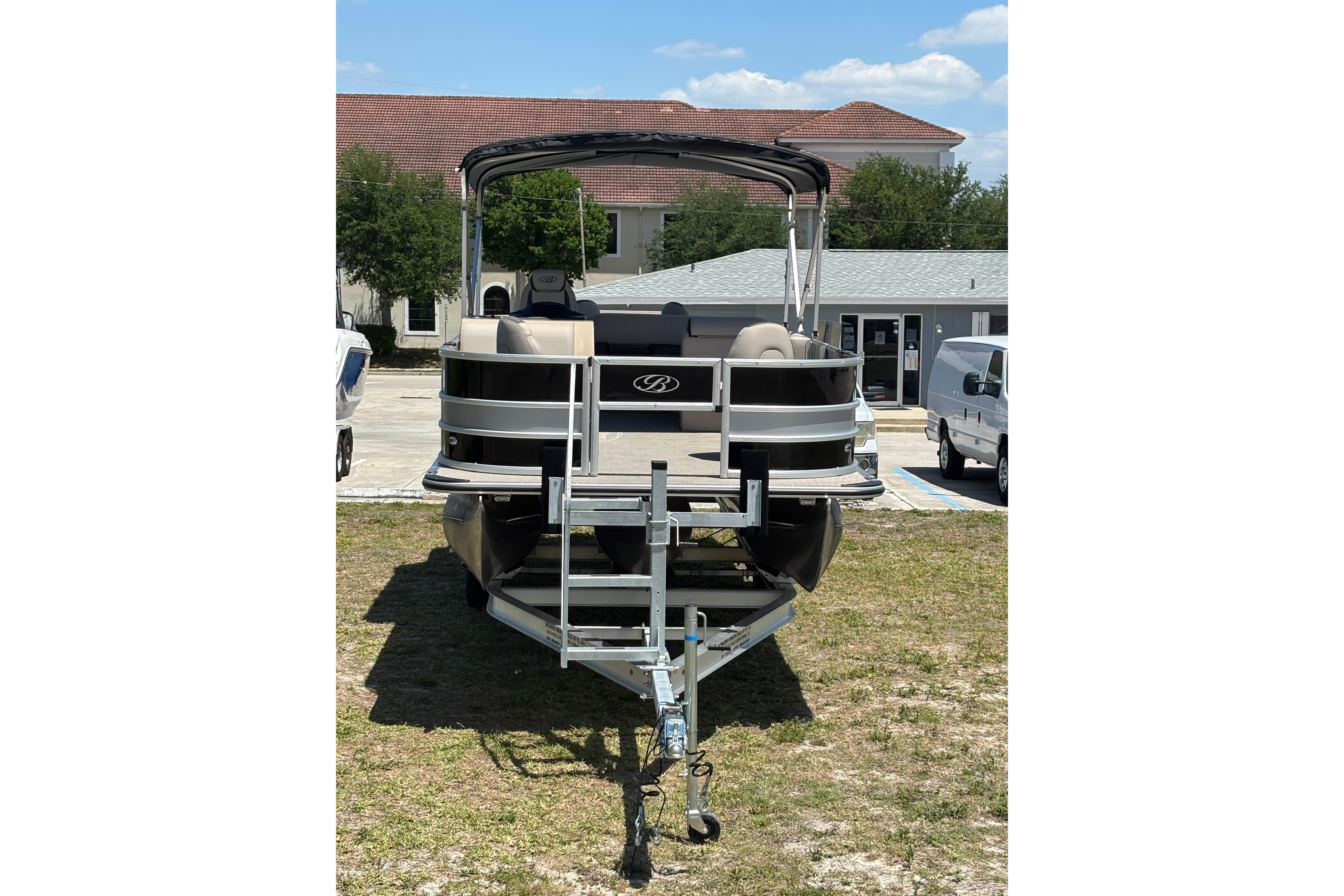 2026 Bentley Pontoons Fish 243 4-Point on trailer, sunny day.