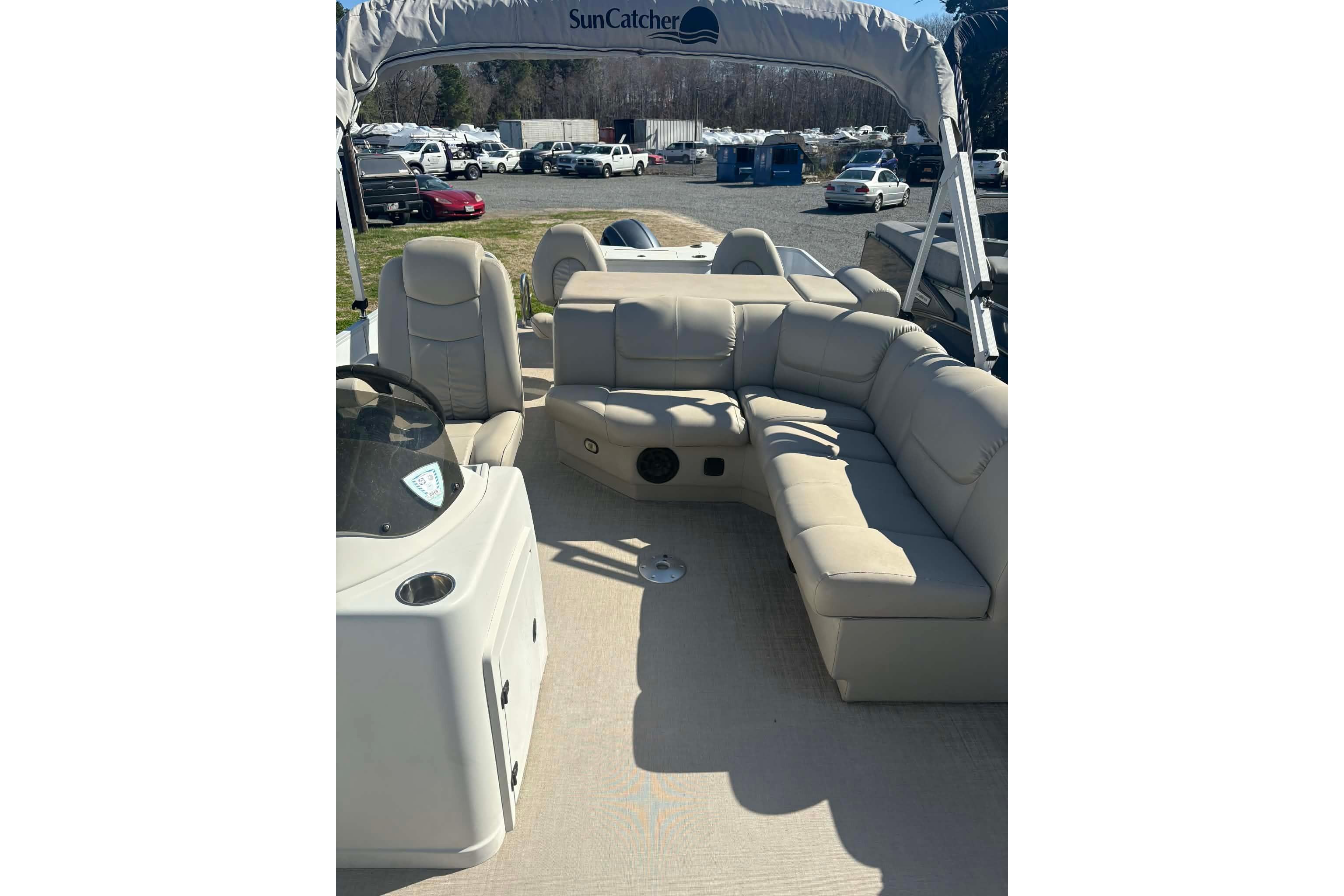 Interior of a 2017 G3 SunCatcher boat with beige seating and canopy.