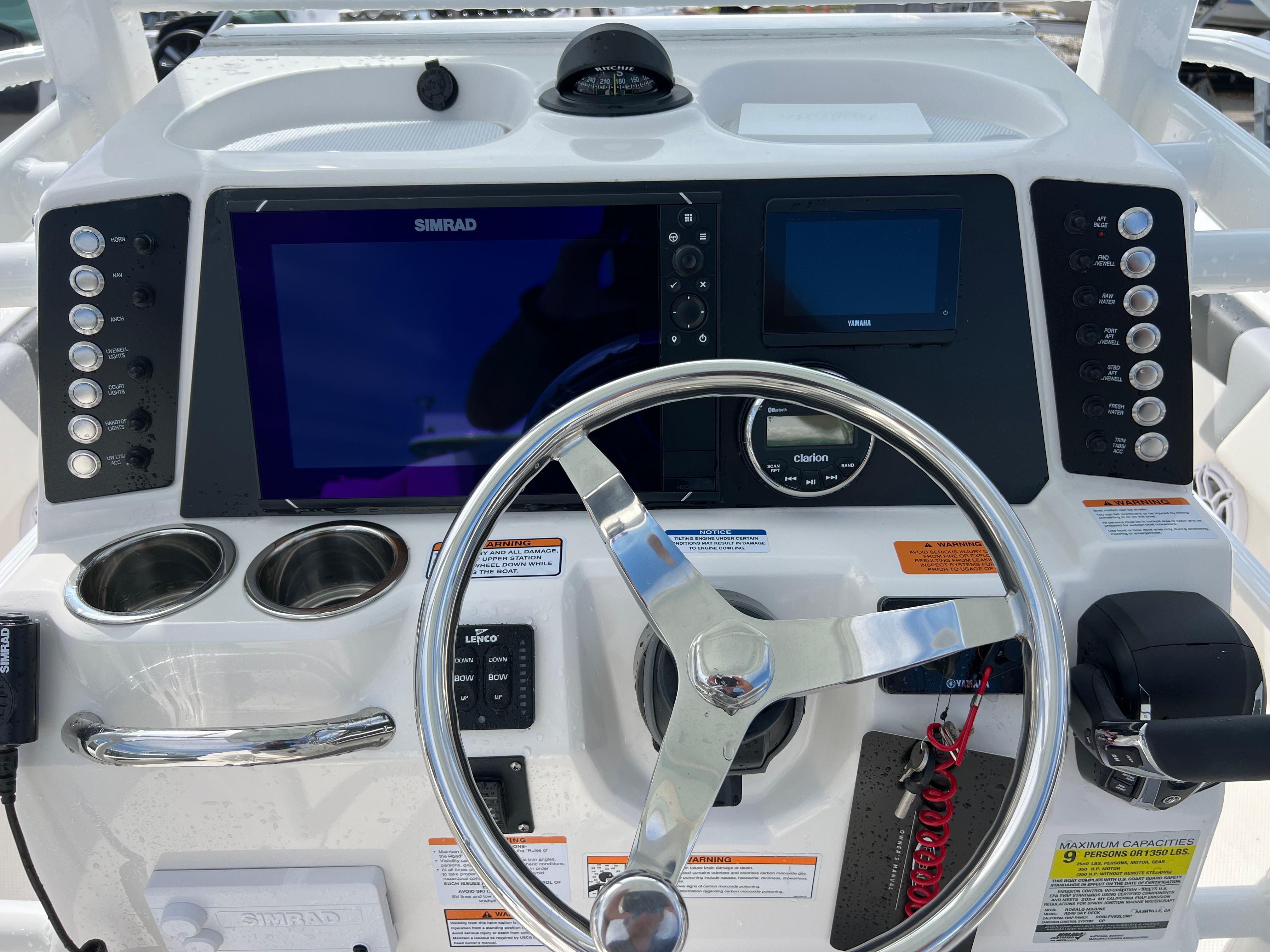 2024 Robalo 246 Sky Deck boat helm with modern navigation system and controls.