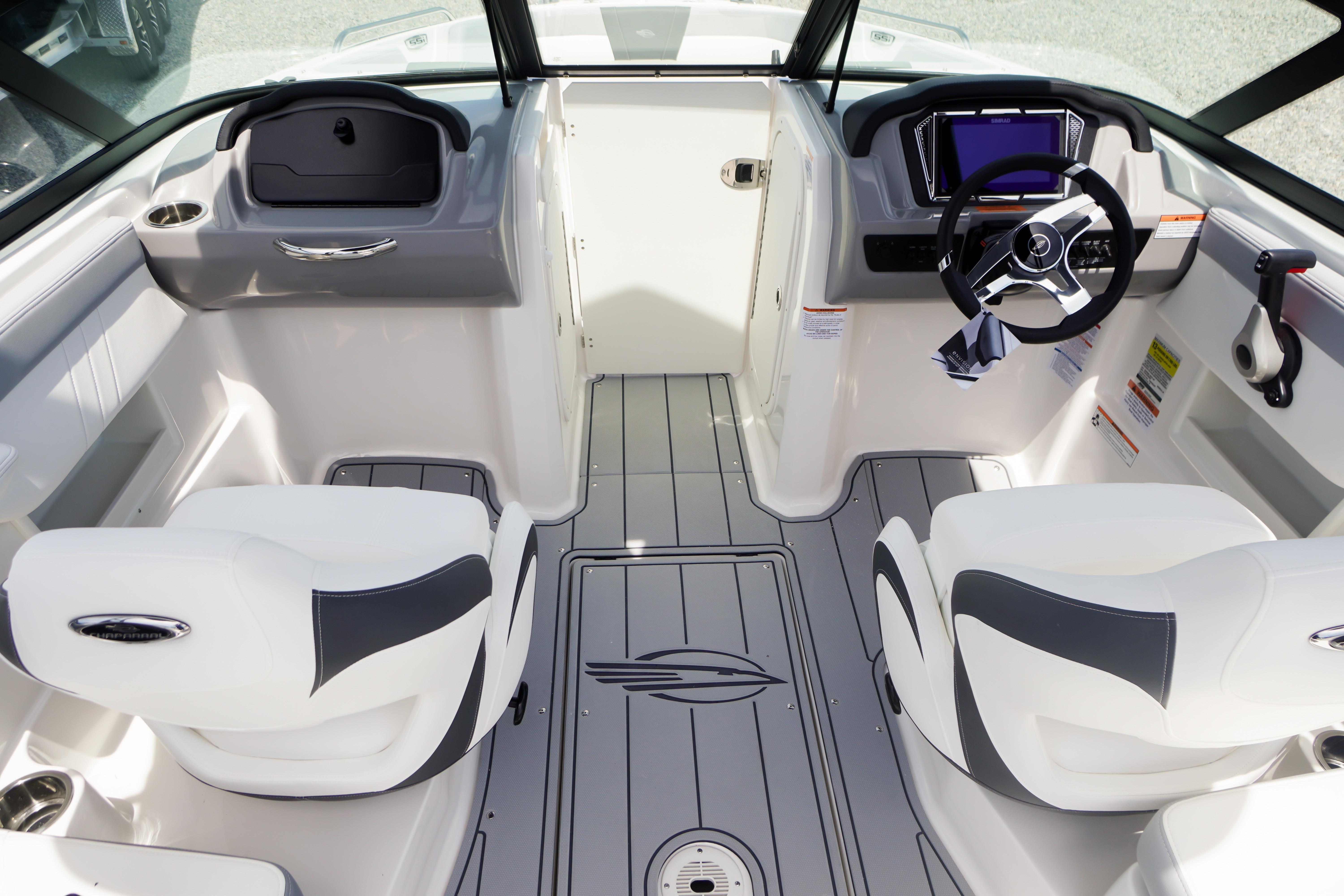 Interior of 2026 Chaparral 23 SSi OB boat, featuring modern helm and seating.