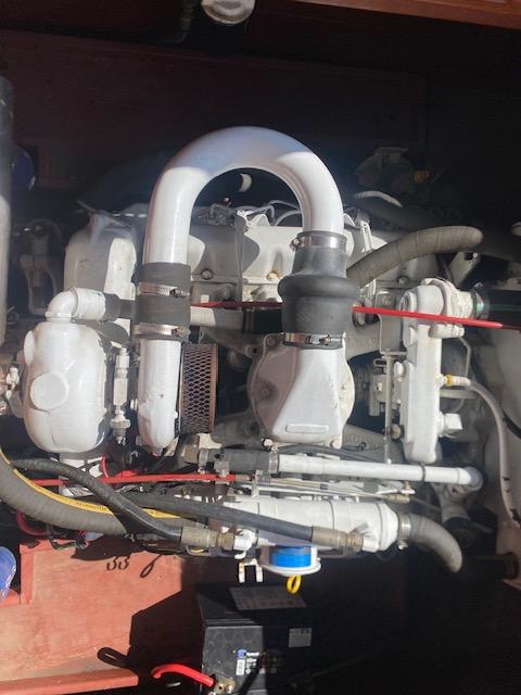 Engine of a 2000 Grand Craft Classic Runabout boat, showcasing intricate mechanical components.
