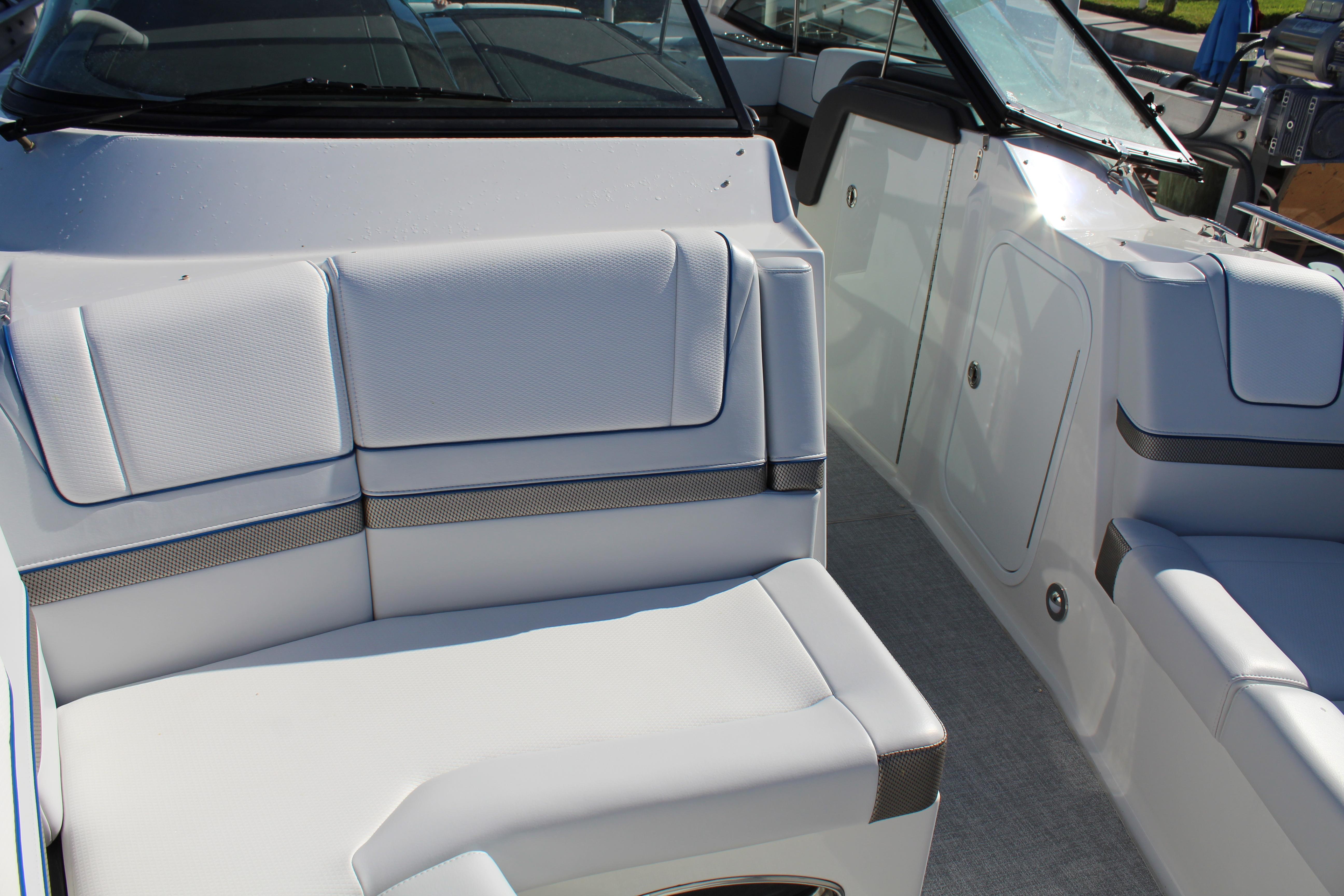 2023 Formula 330 Crossover Bowrider interior with white seating and sleek design.
