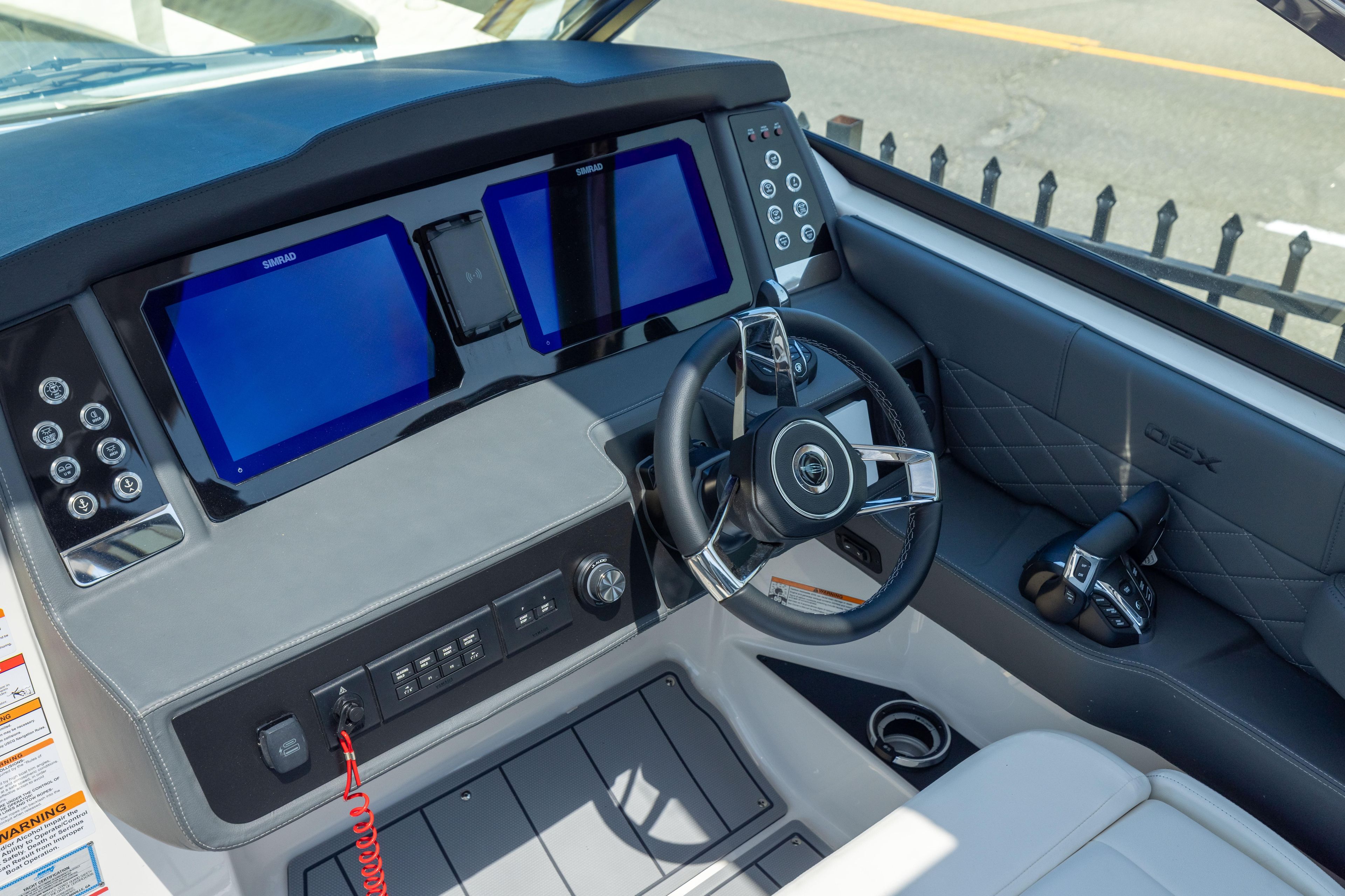 2026 Chaparral 310 OSX helm with dual screens and modern controls.