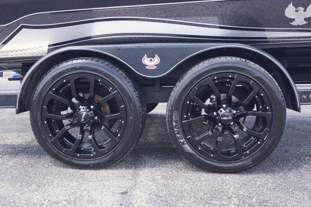 Black wheels on a 2026 Phoenix 921 Elite X trailer, featuring Helo rims and Kenda tires.
