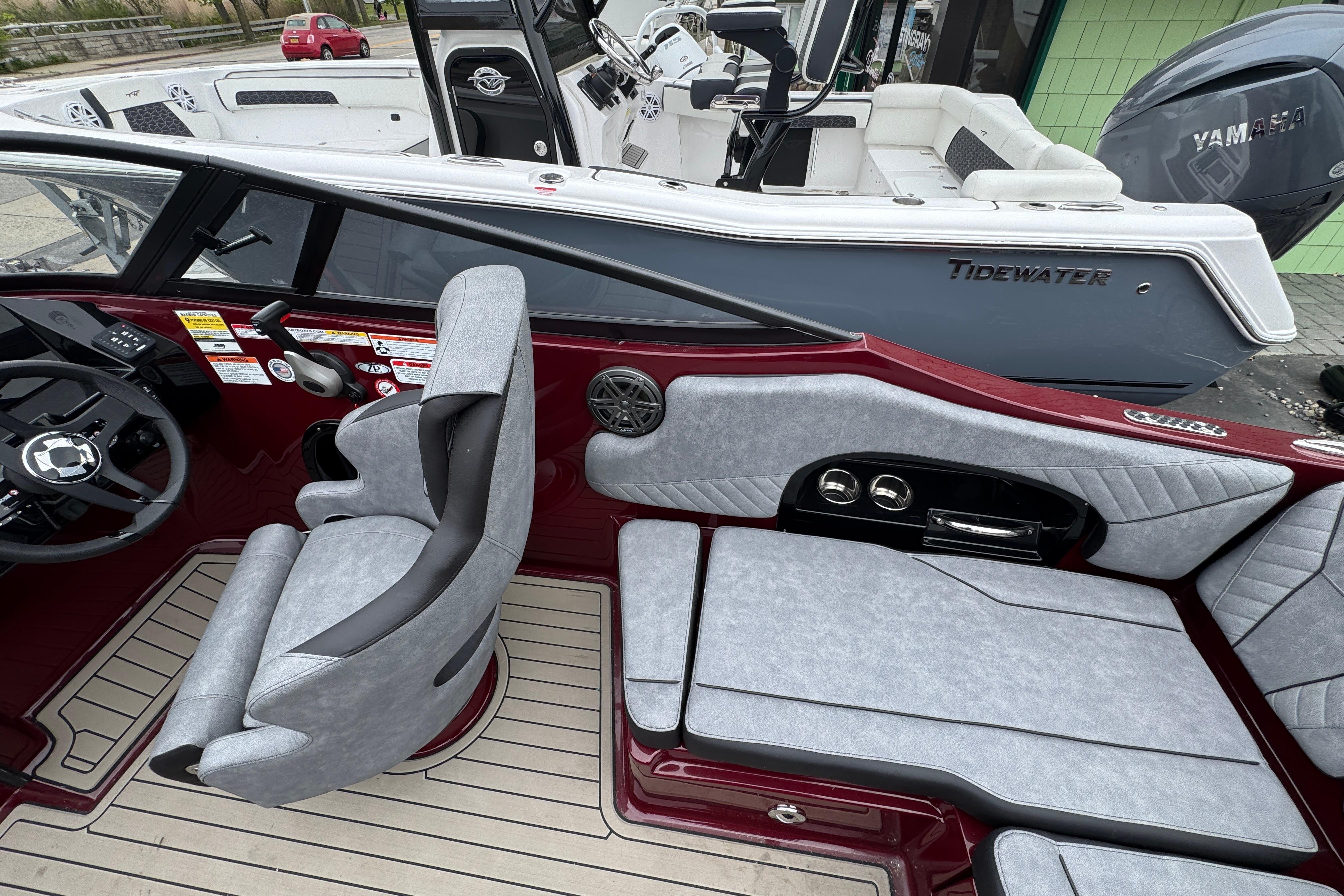 Interior of 2026 Stingray 23 OCX boat with modern seating and steering wheel.