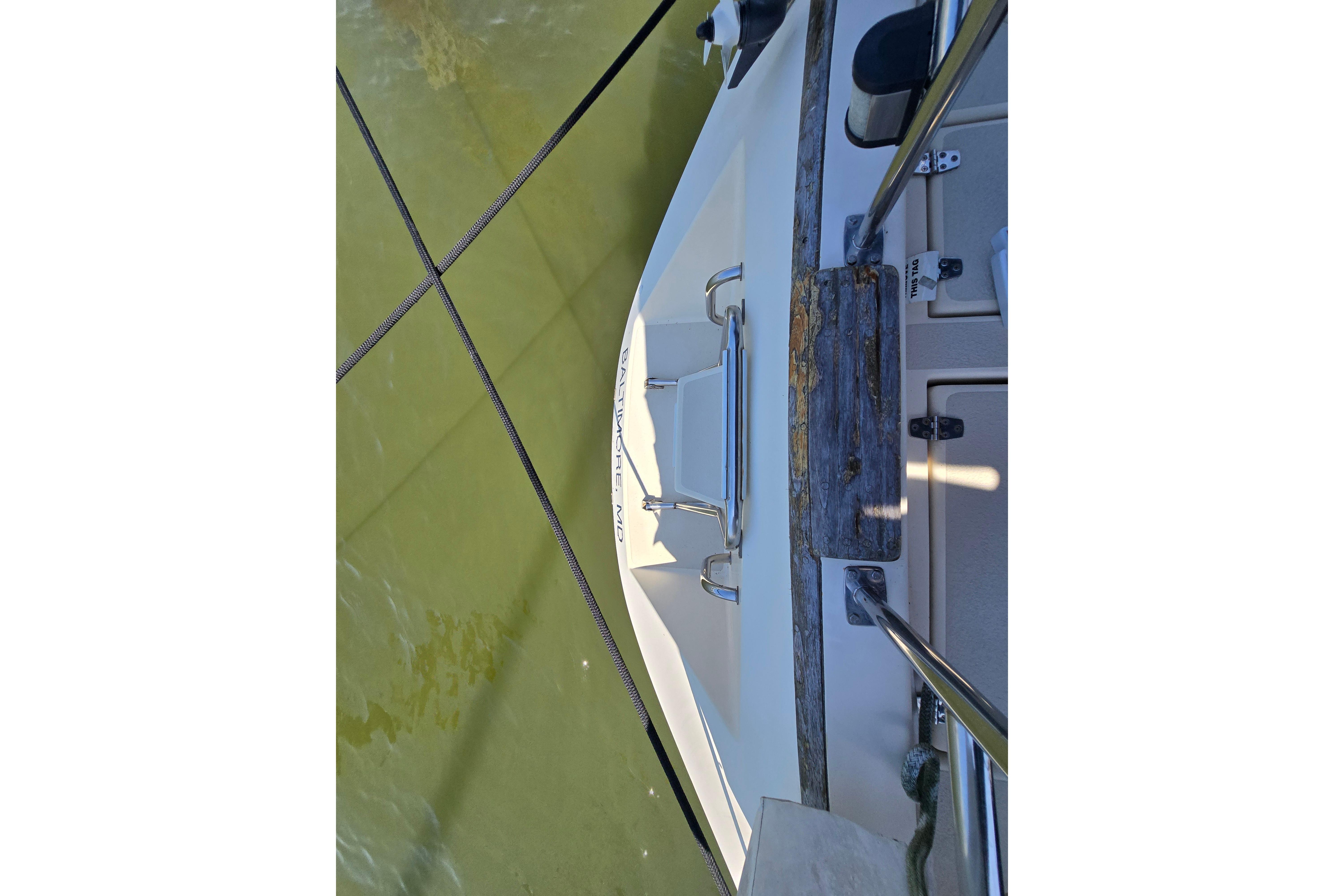 Overhead view of 1993 Caliber 35 boat deck with railing and water.