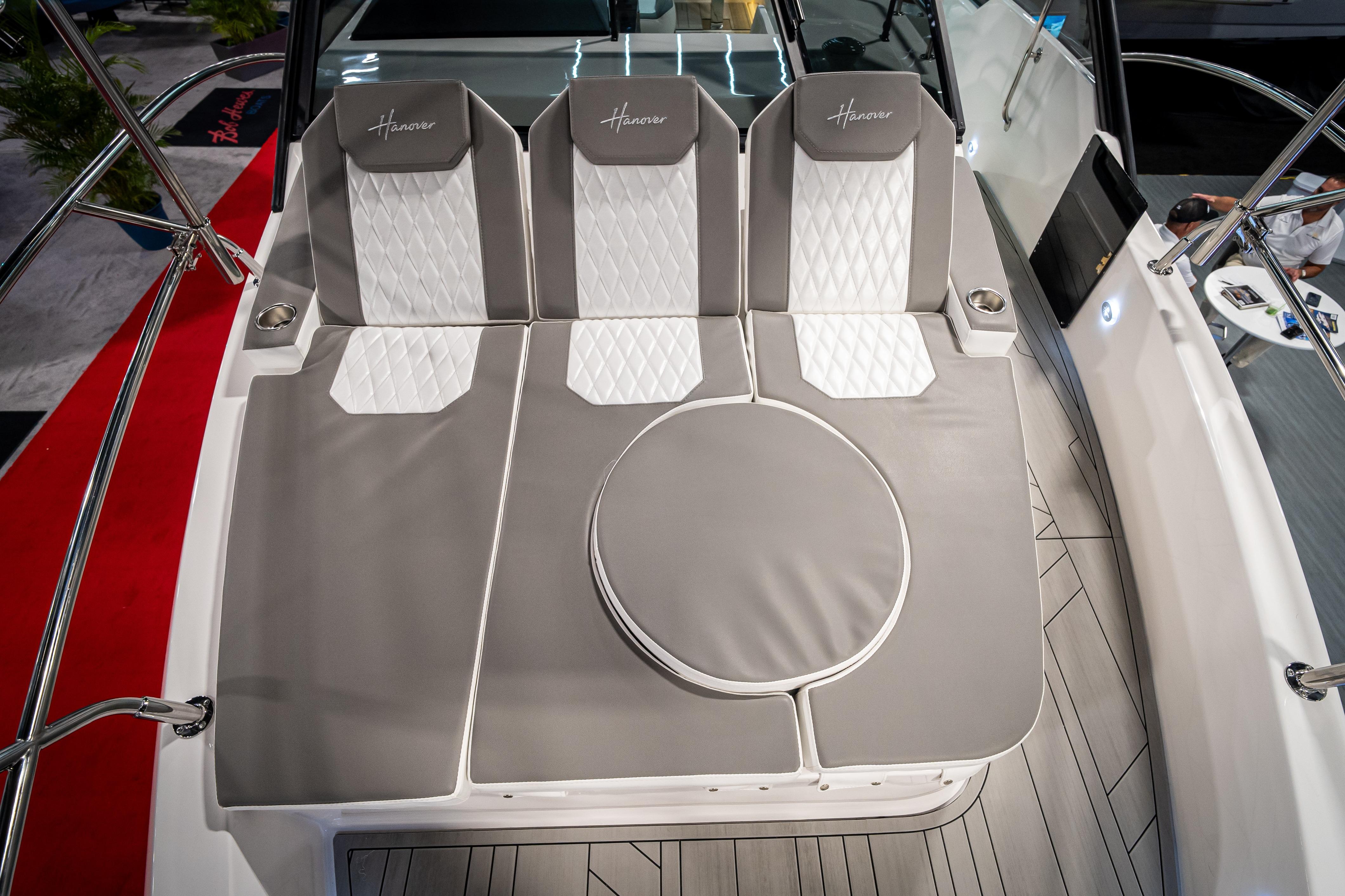 2026 Hanover 347 boat interior with luxurious gray and white seating.