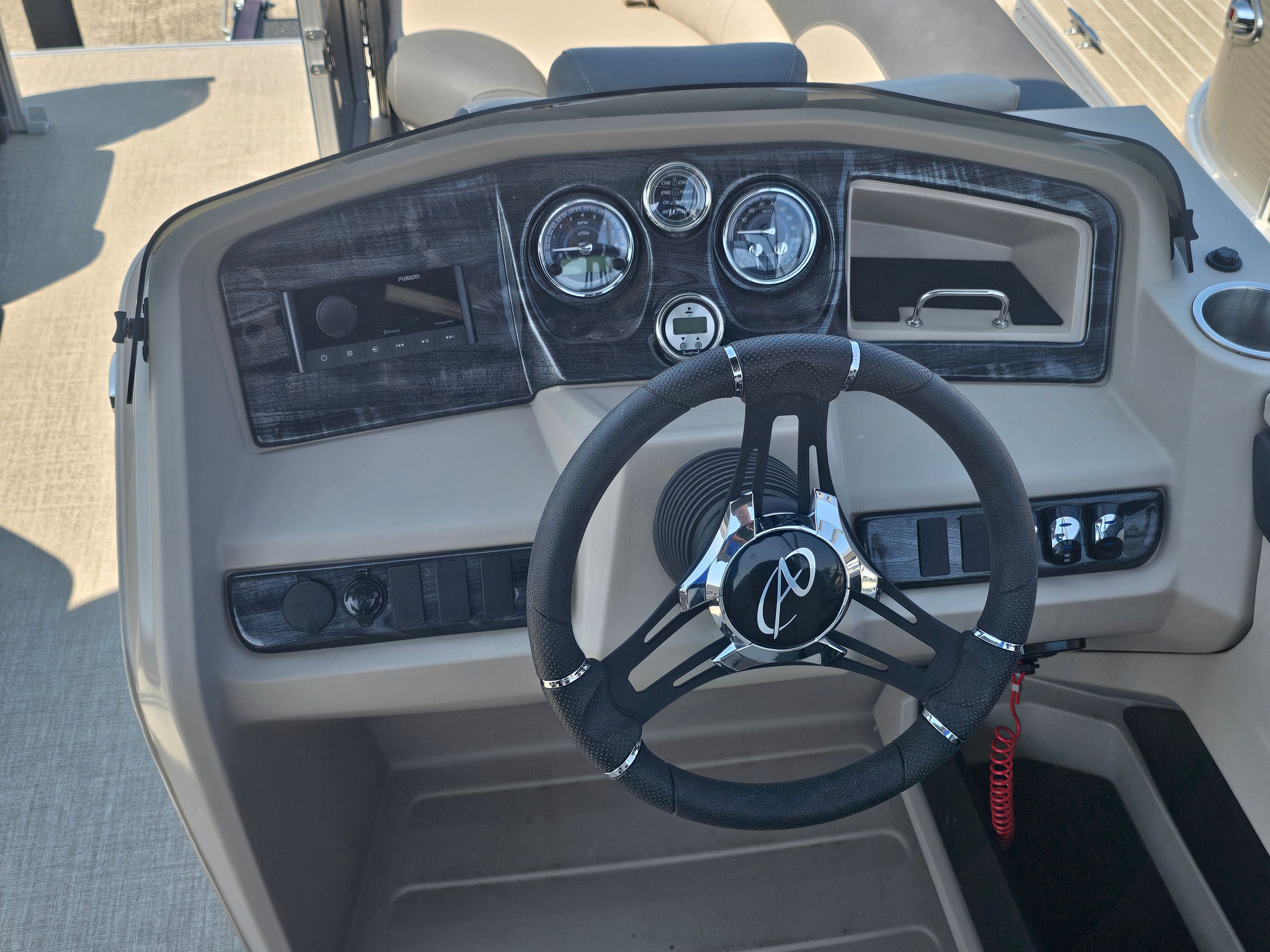 2024 Avalon LSZ 2385 QL helm with steering wheel and gauges.