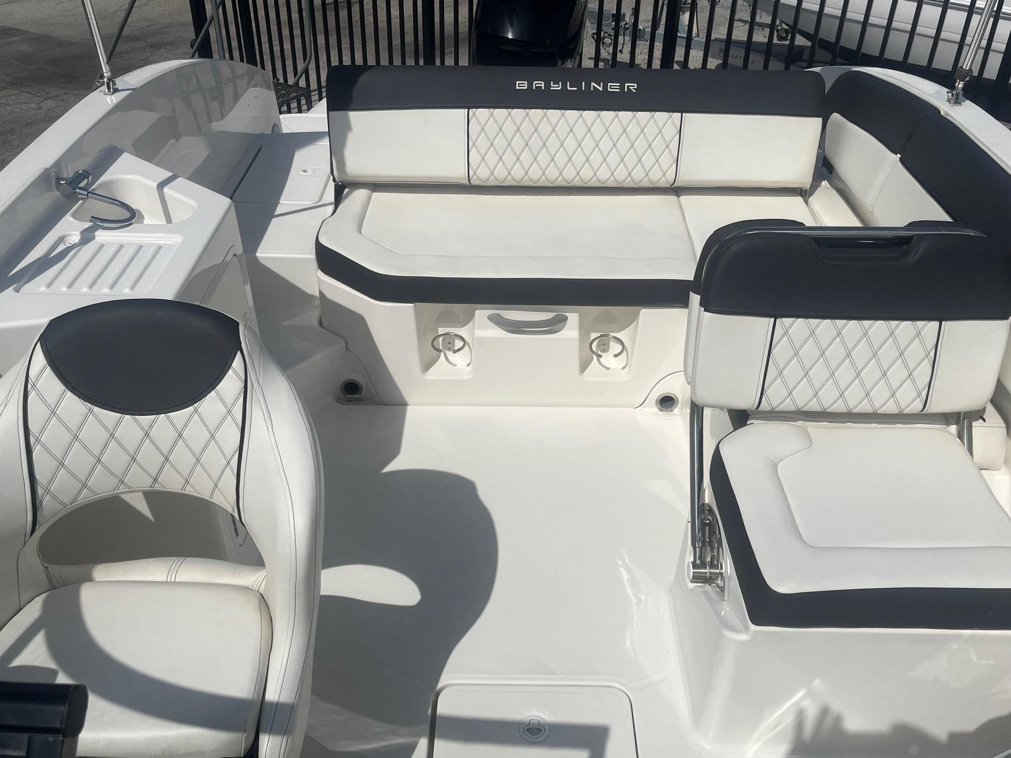 2022 Bayliner DX 2200 boat interior with white and black seating, showcasing modern design.