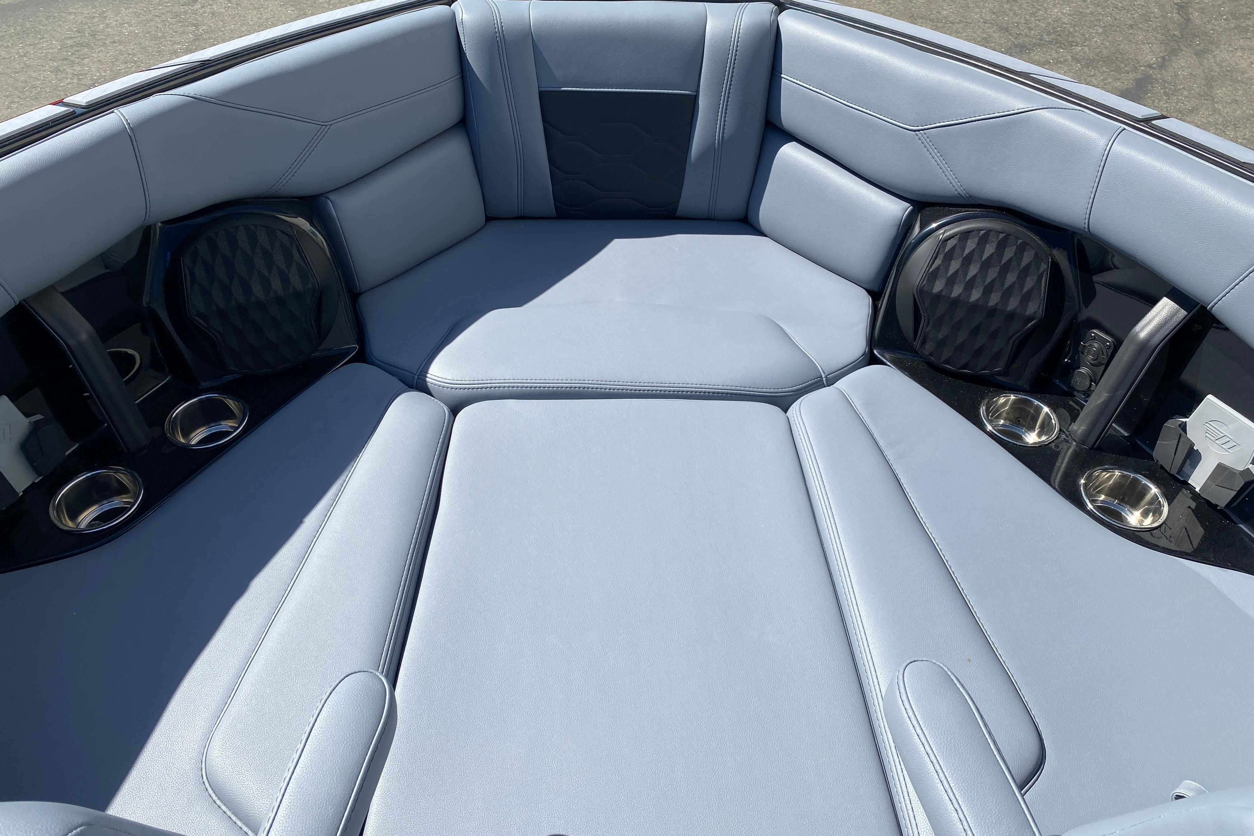 2025 Malibu Wakesetter 23 LSV interior with luxurious seating and cup holders.