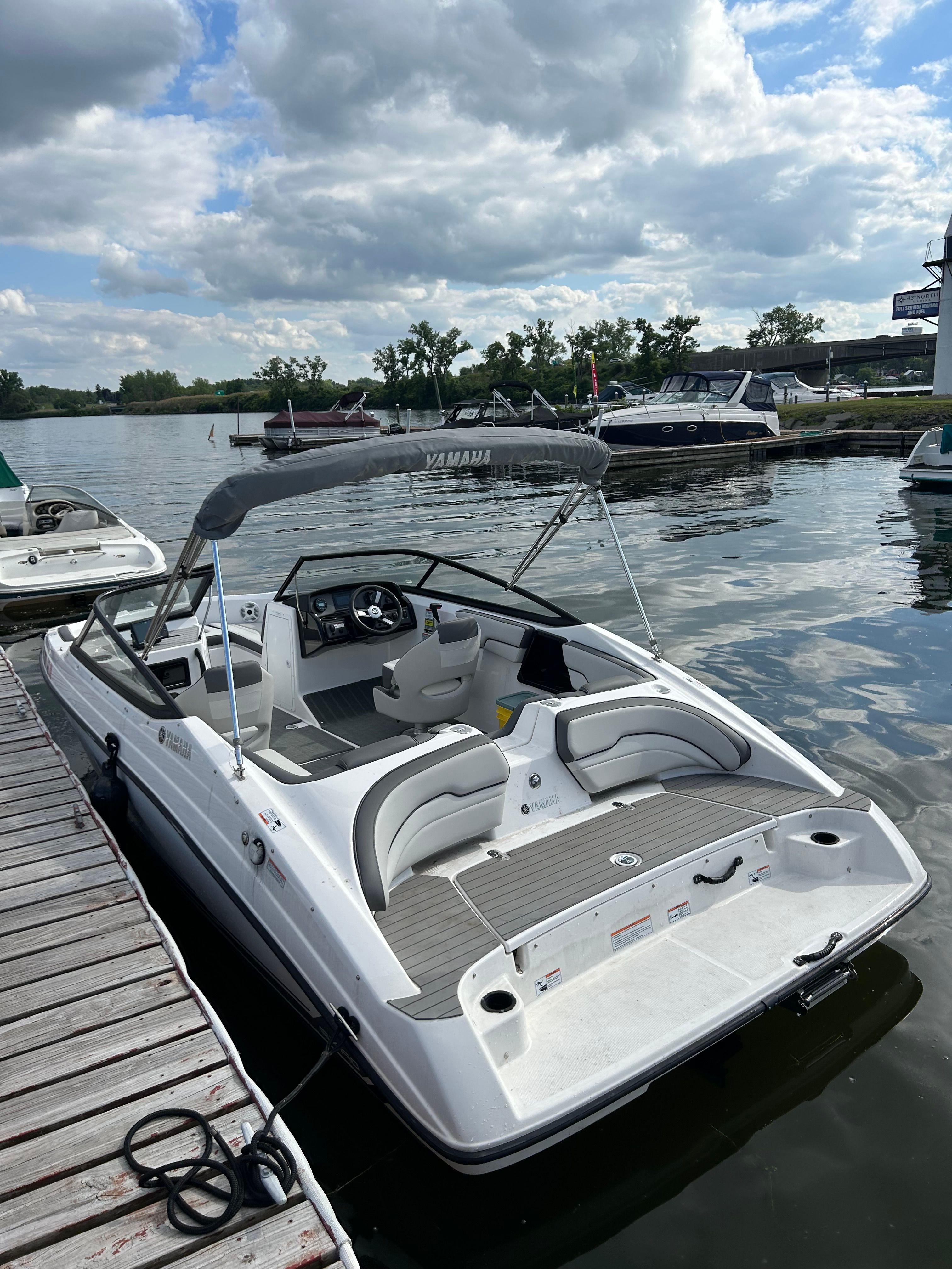 2020 Yamaha SX190 boat docked under cloudy sky.