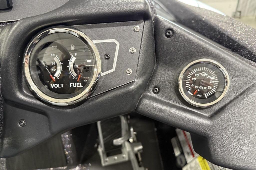 Dashboard of 2025 Skeeter ZX150 showing volt, fuel, and water pressure gauges.