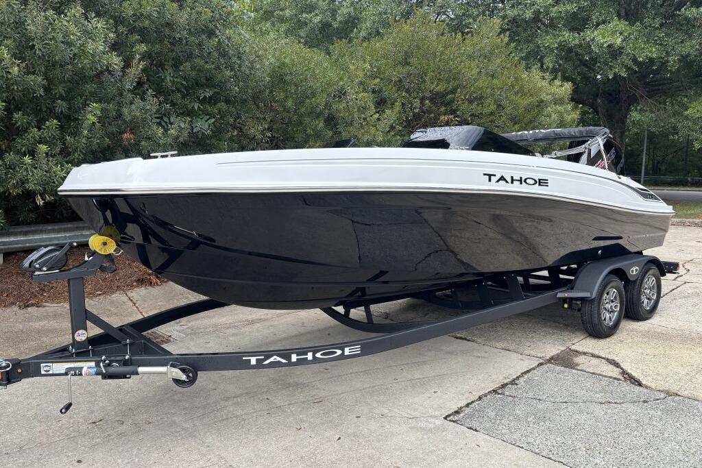 2026 Tahoe T21 boat on trailer, sleek design, parked outdoors.