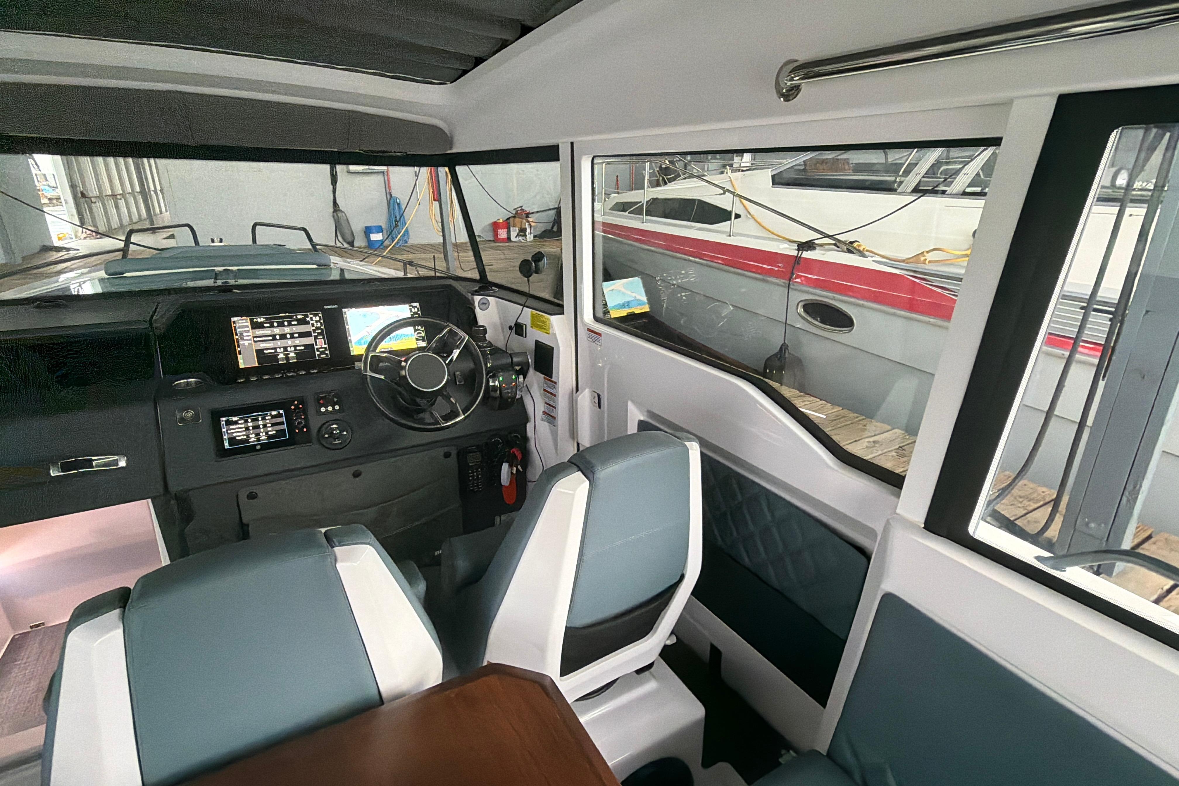 Interior of 2022 Axopar Brabus 37 XC Cross Cabin with modern dashboard and seating.