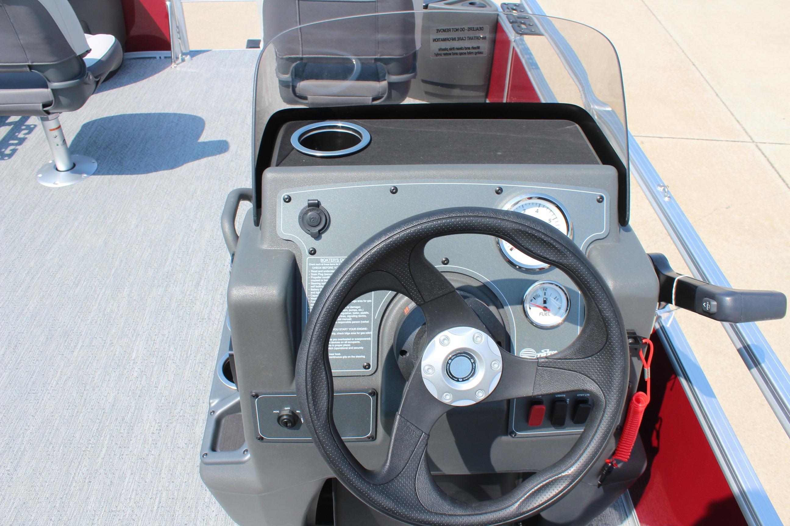 2026 Sun Tracker Bass Buggy 18 DLX steering console with gauges and controls.