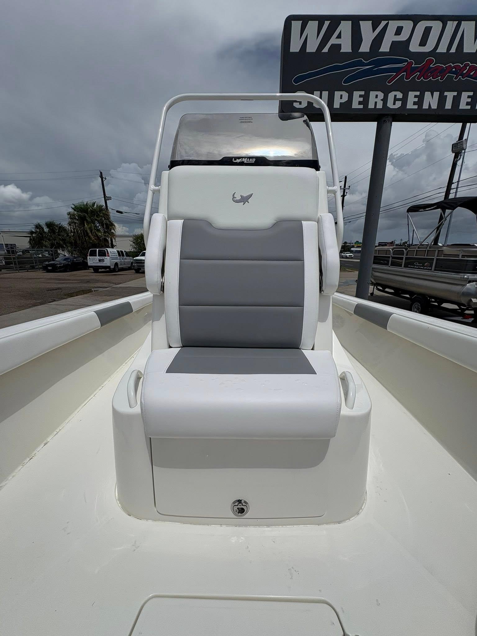 2025 Mako 24 APEX boat seat with gray and white upholstery at Waypoint Marine.