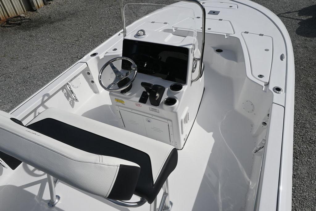 2026 Tidewater 1910 Bay Max boat interior with steering console and seating.