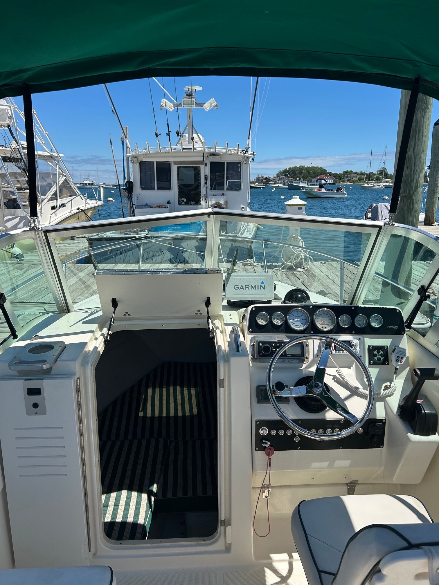 Interior view of a 1999 Pursuit Denali boat at the dock.