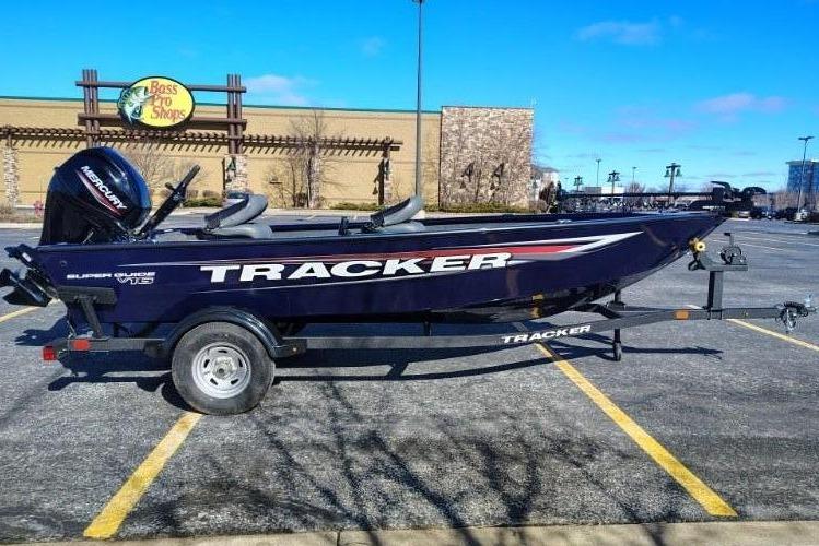 2026 Tracker Super Guide V-16 T boat in parking lot.