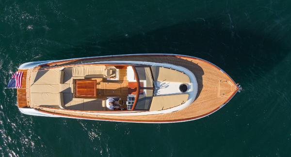 Aerial view of 2023 Vento V40 Retro Classic Open boat on water.