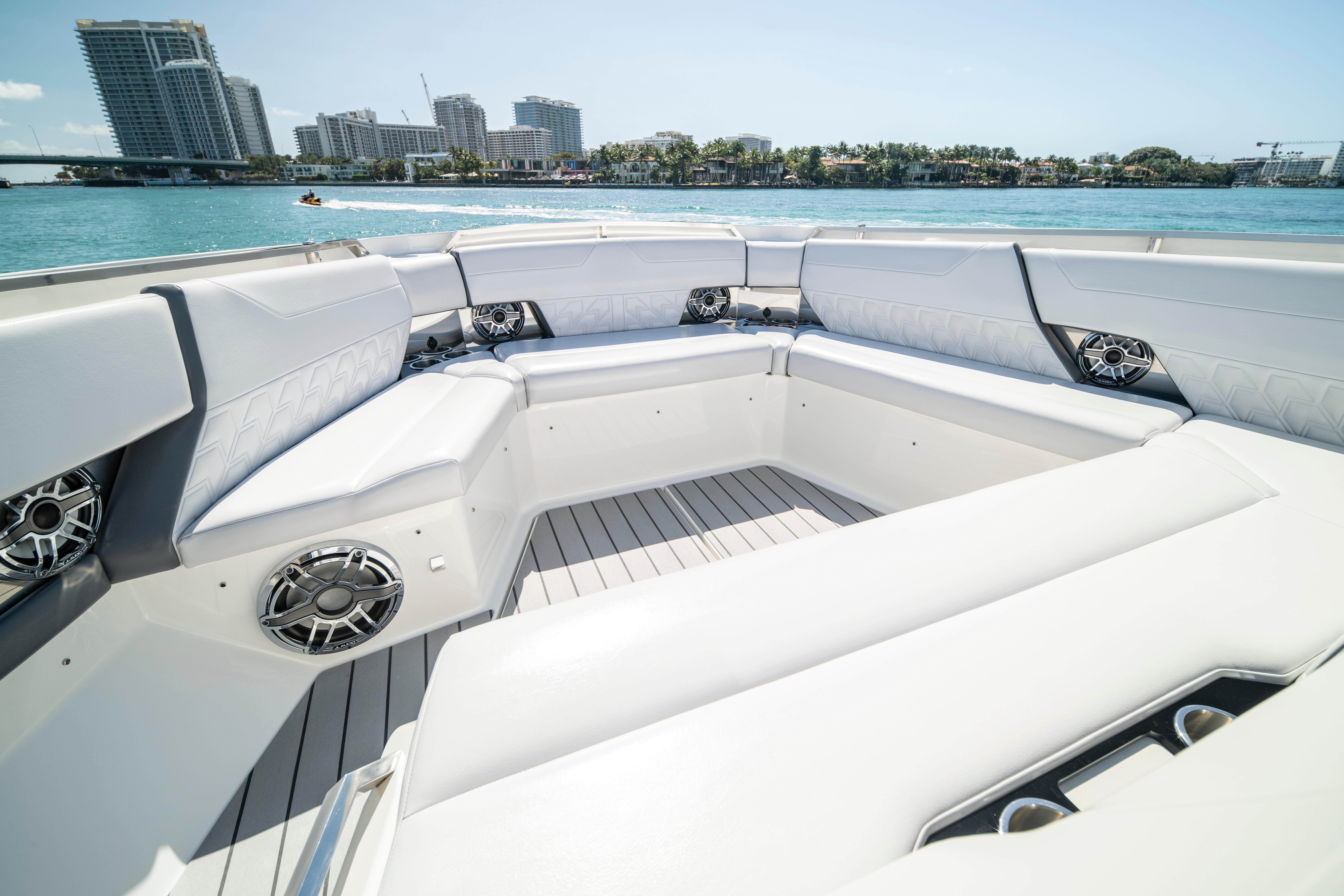 Luxurious seating area on 2022 Formula 500 Super Sport Crossover boat, with waterfront city view.
