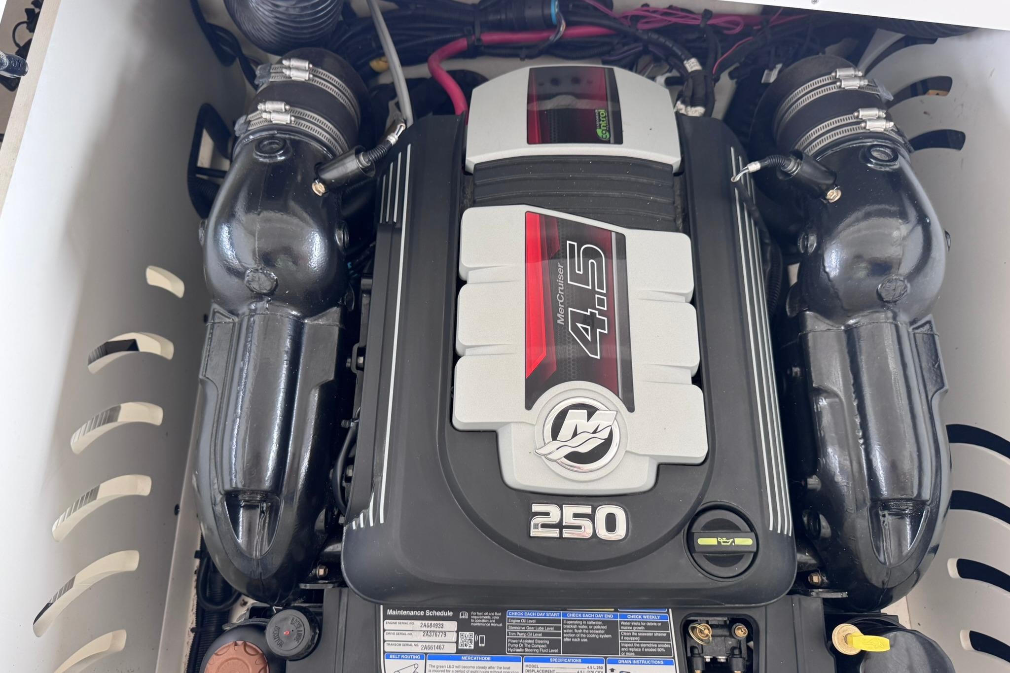 Engine compartment of a 2021 Sea Ray SPX 230 with MerCruiser 4.5L engine.