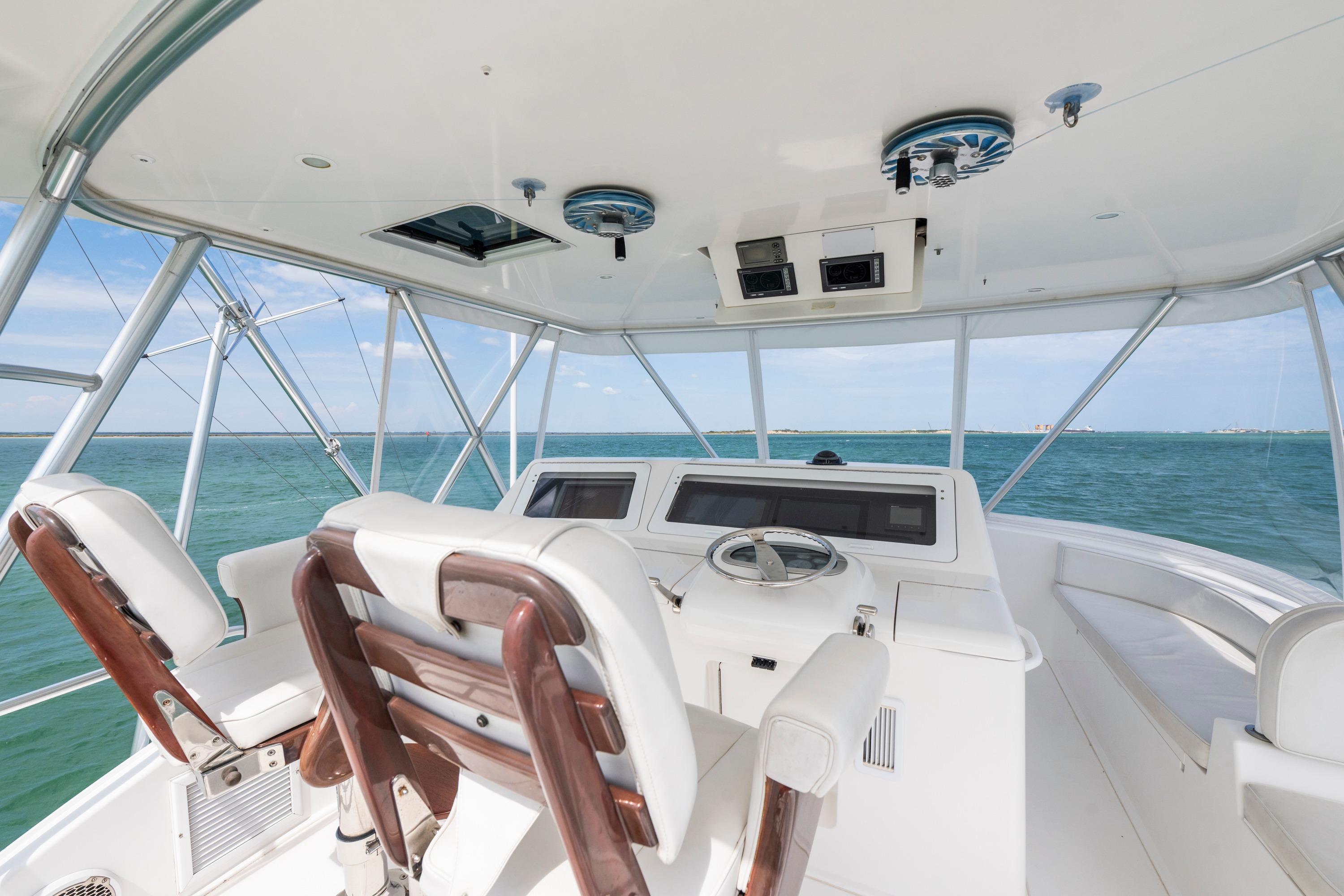 2009 Viking 50 Convertible yacht helm with ocean view and modern controls.