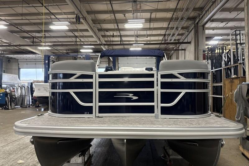 2026 Bennington 23 SSRSF pontoon boat in a warehouse setting.