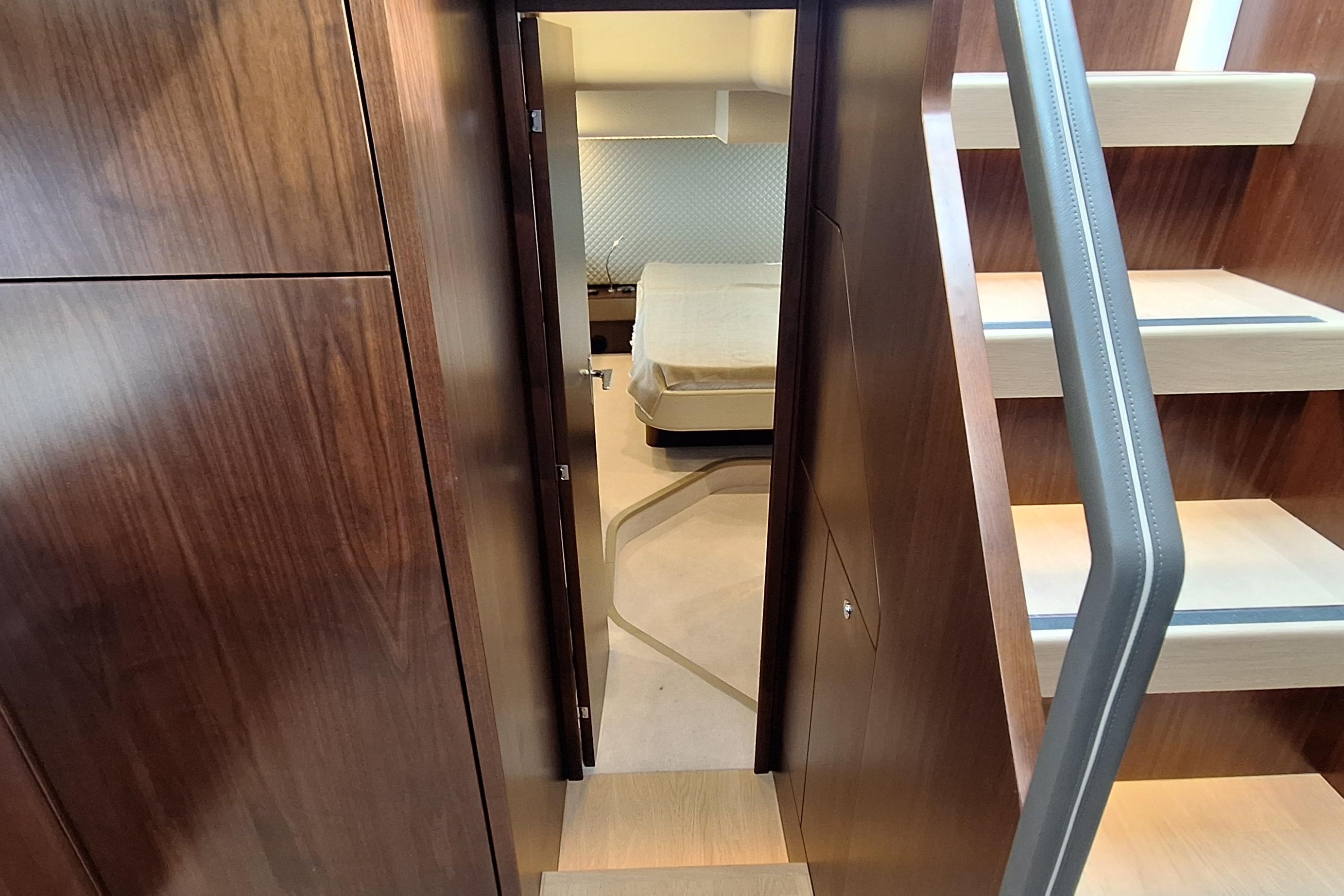 Interior view of 2022 Fairline Targa 53 yacht, featuring wooden finishes and modern design.