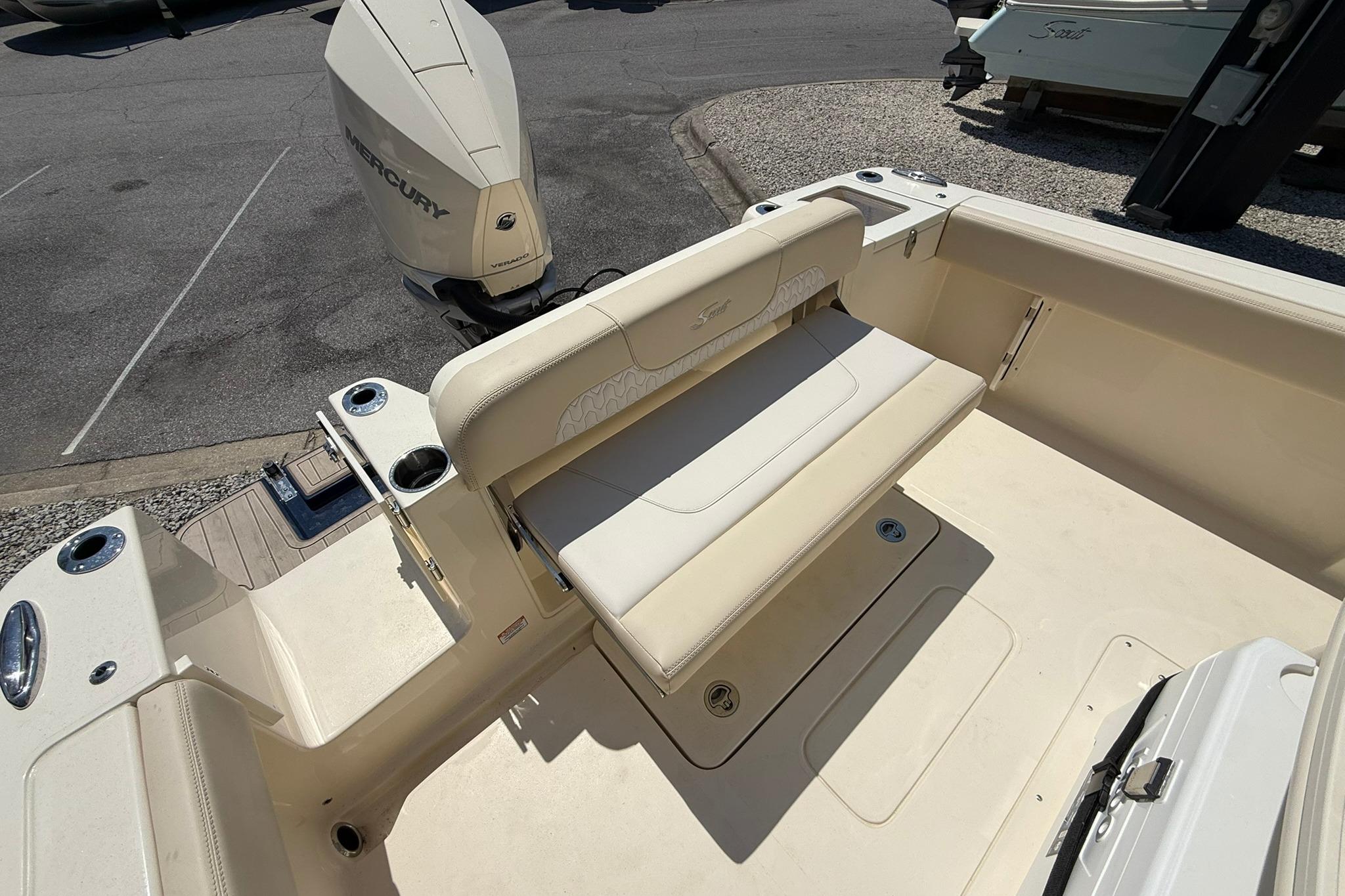 2027 Scout 240 XSF boat interior with seating and Mercury engine.