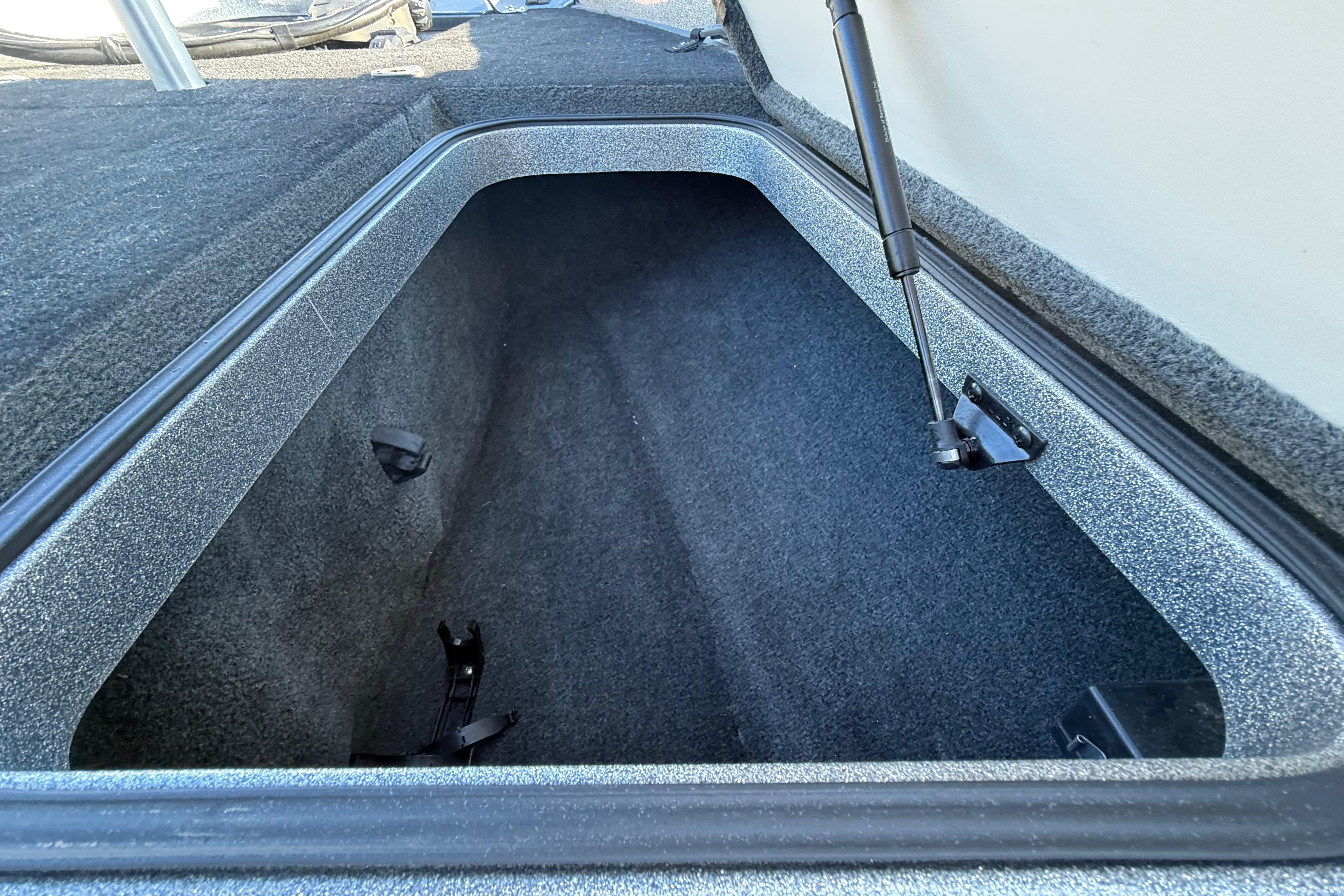 2013 Ranger Z117 boat storage compartment with open lid and hydraulic support.